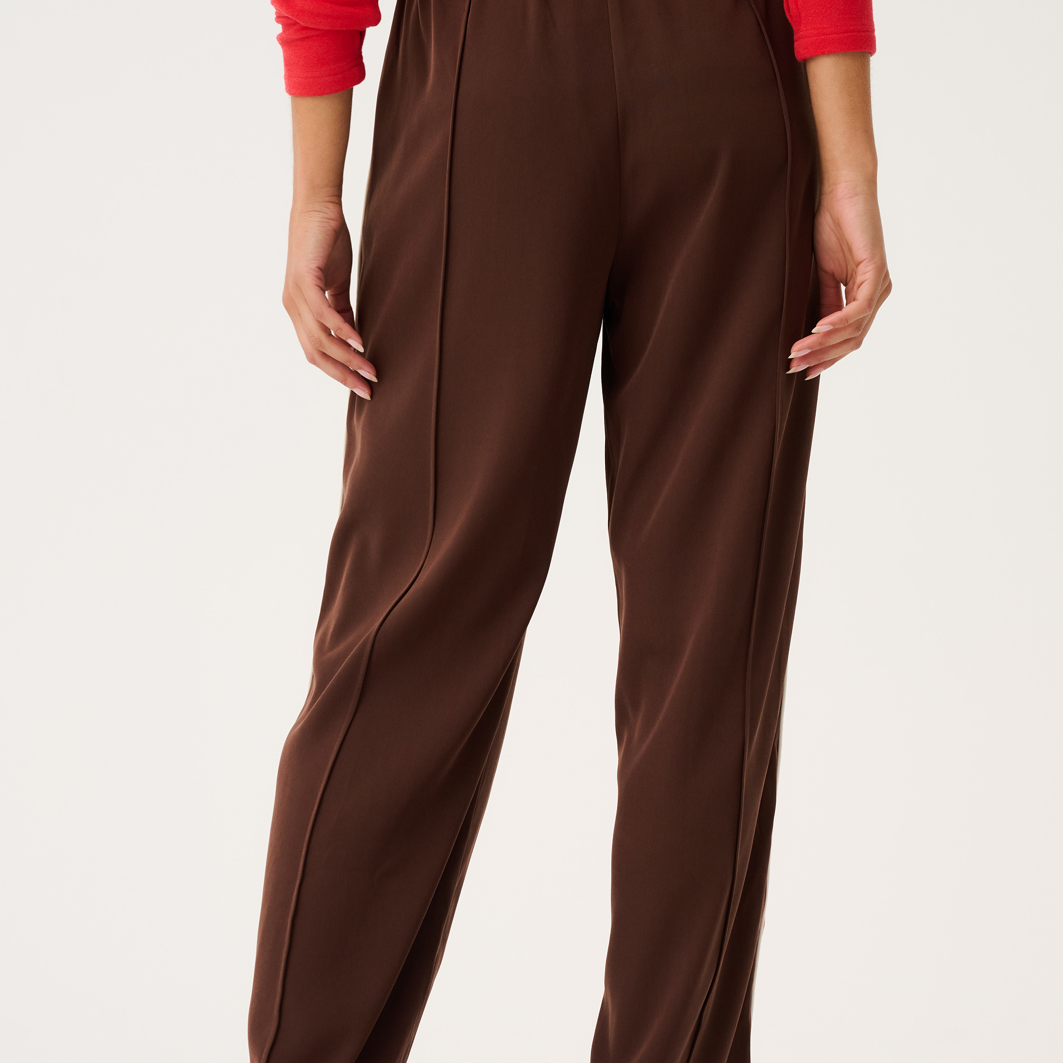 Back view of Dusty Pant in truffle brown showing straight leg silhouette and high-rise elastic waistband