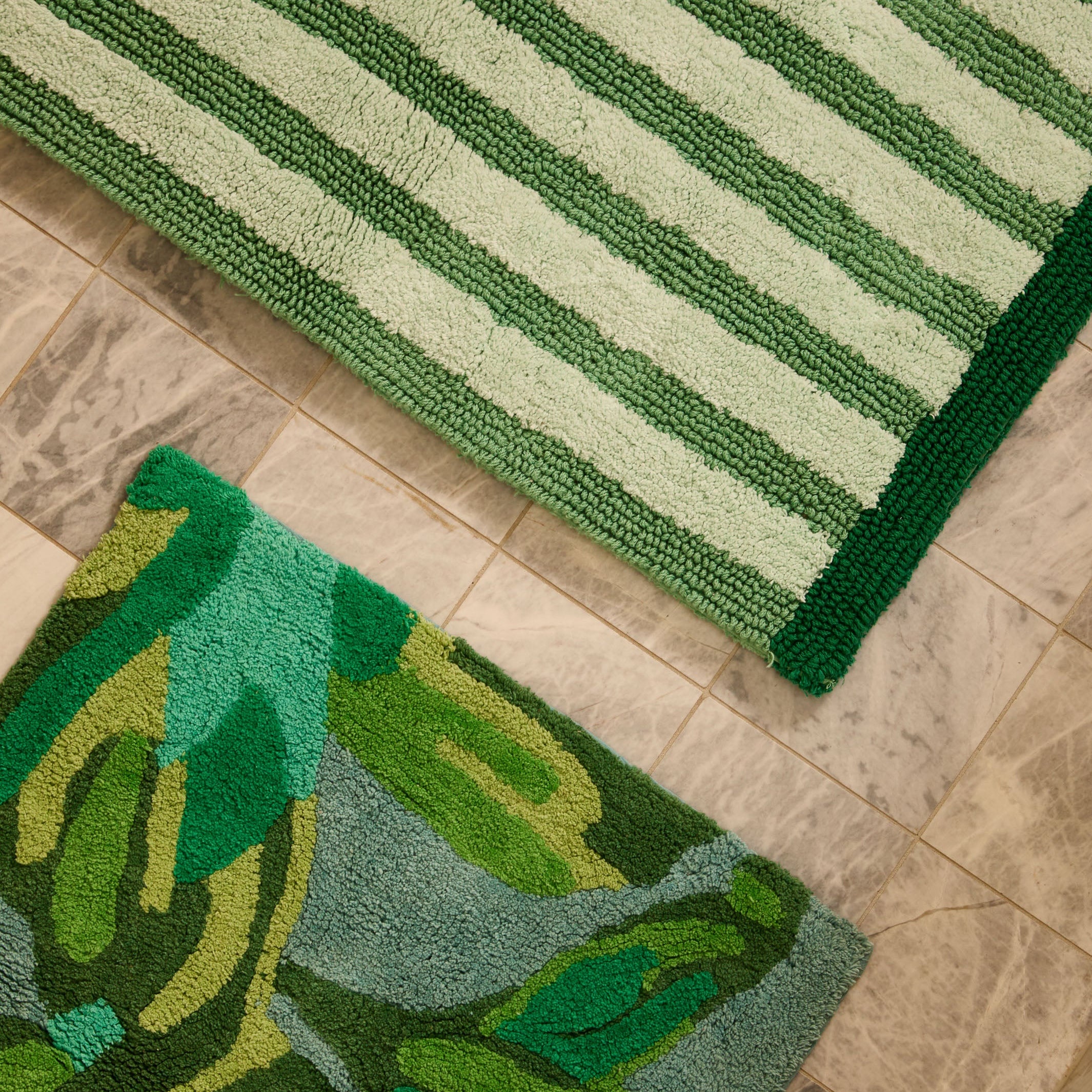 Close-up detail showing hand tufted cotton texture and floral pattern on Dutch Floral Green Bath Mat