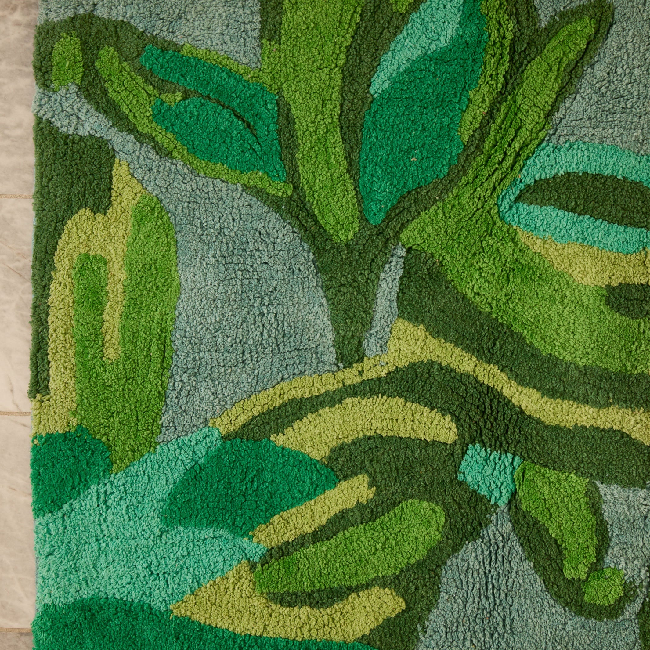 Overhead view of Dutch Floral Green Bath Mat showing complete tulip and leaf pattern design