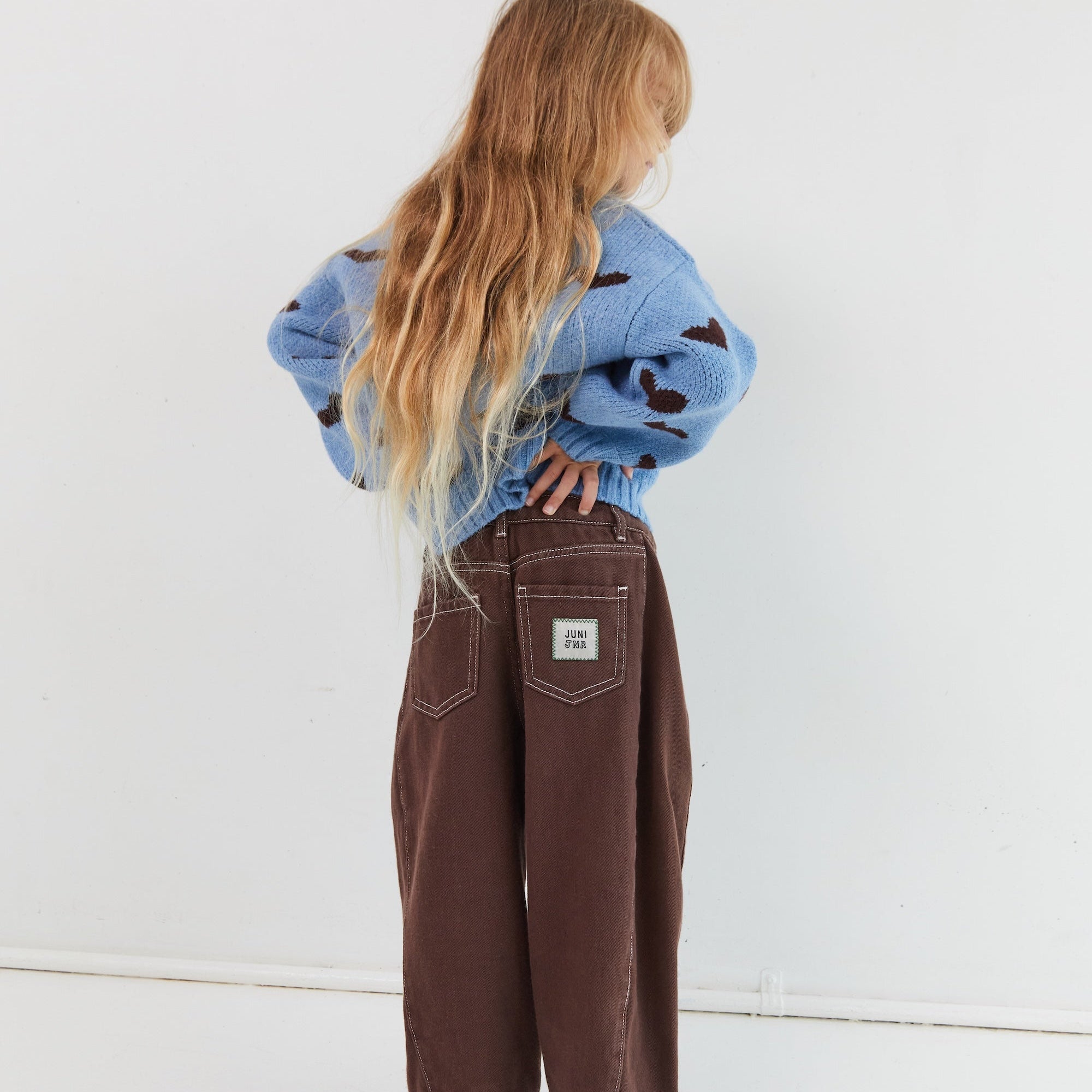 girl wearing Cocoa brown relaxed barrel leg jeans elasticated waist Juni Dylan
