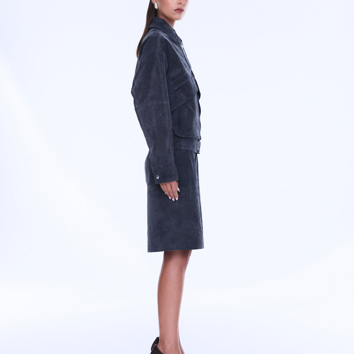Side profile view of Emma Utility Suede Jacket displaying knee-length silhouette and utility pocket details