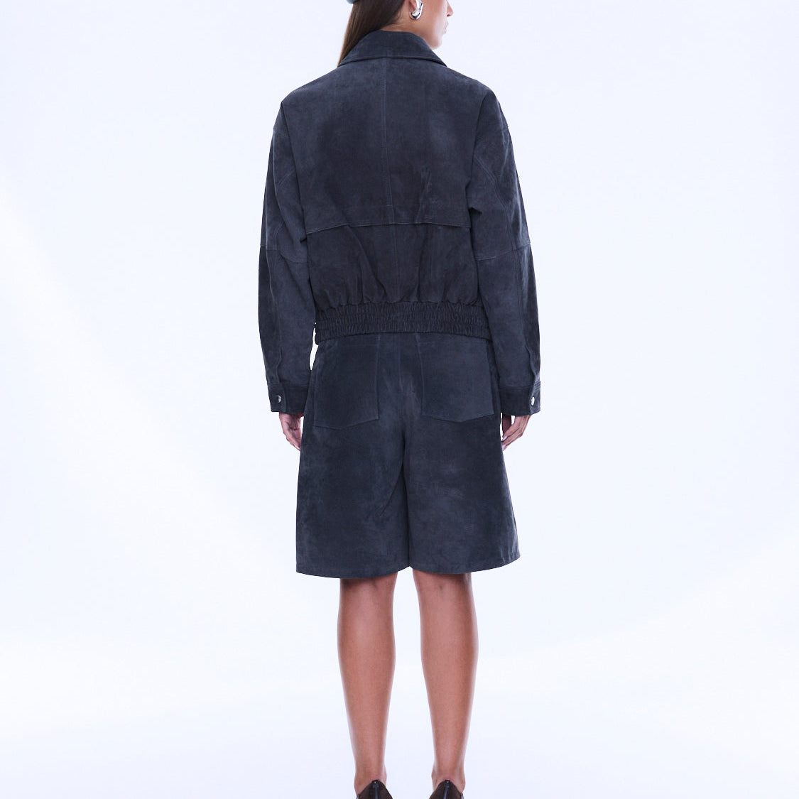 Back view of Emma Utility Suede Jacket showing gathered waist detail and full-length navy suede construction