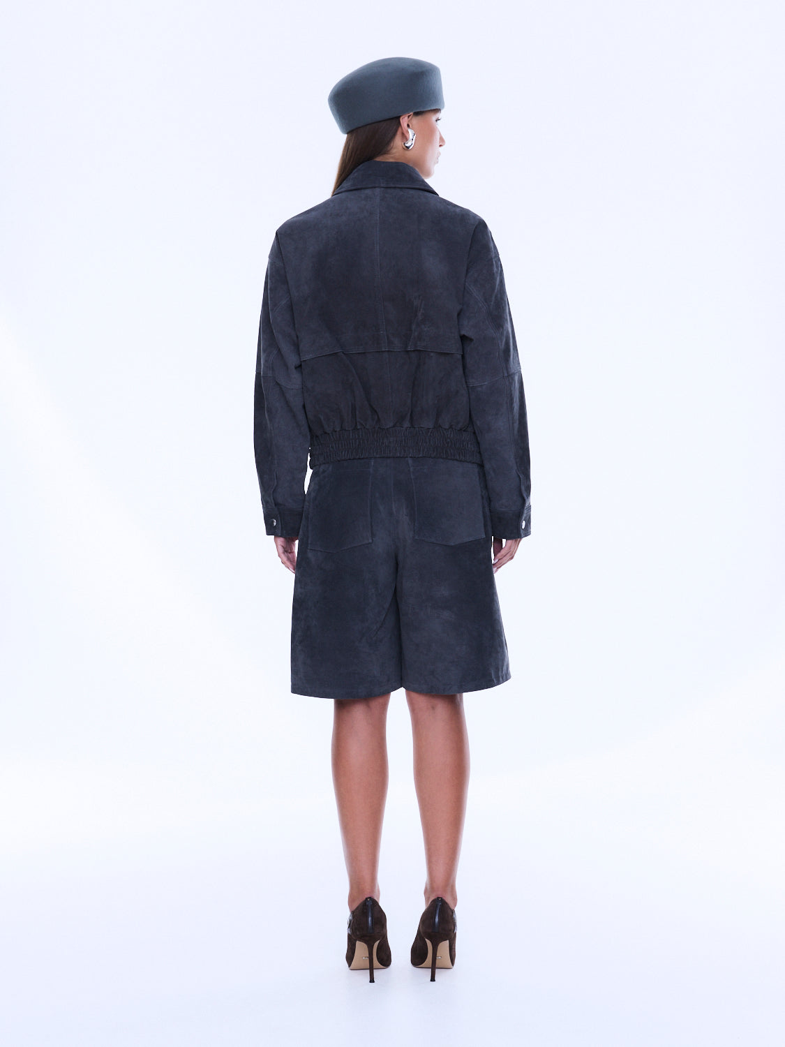 Back view of Emma Utility Suede Jacket showing gathered waist detail and full-length navy suede construction