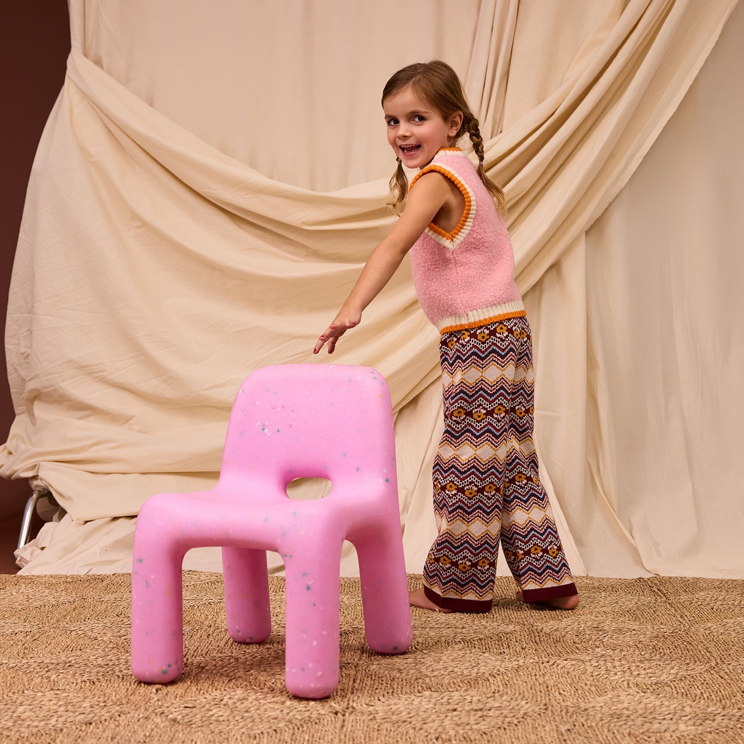 Full body view showing Kids Knit Vest with sleeveless design and ribbed neckline armholes