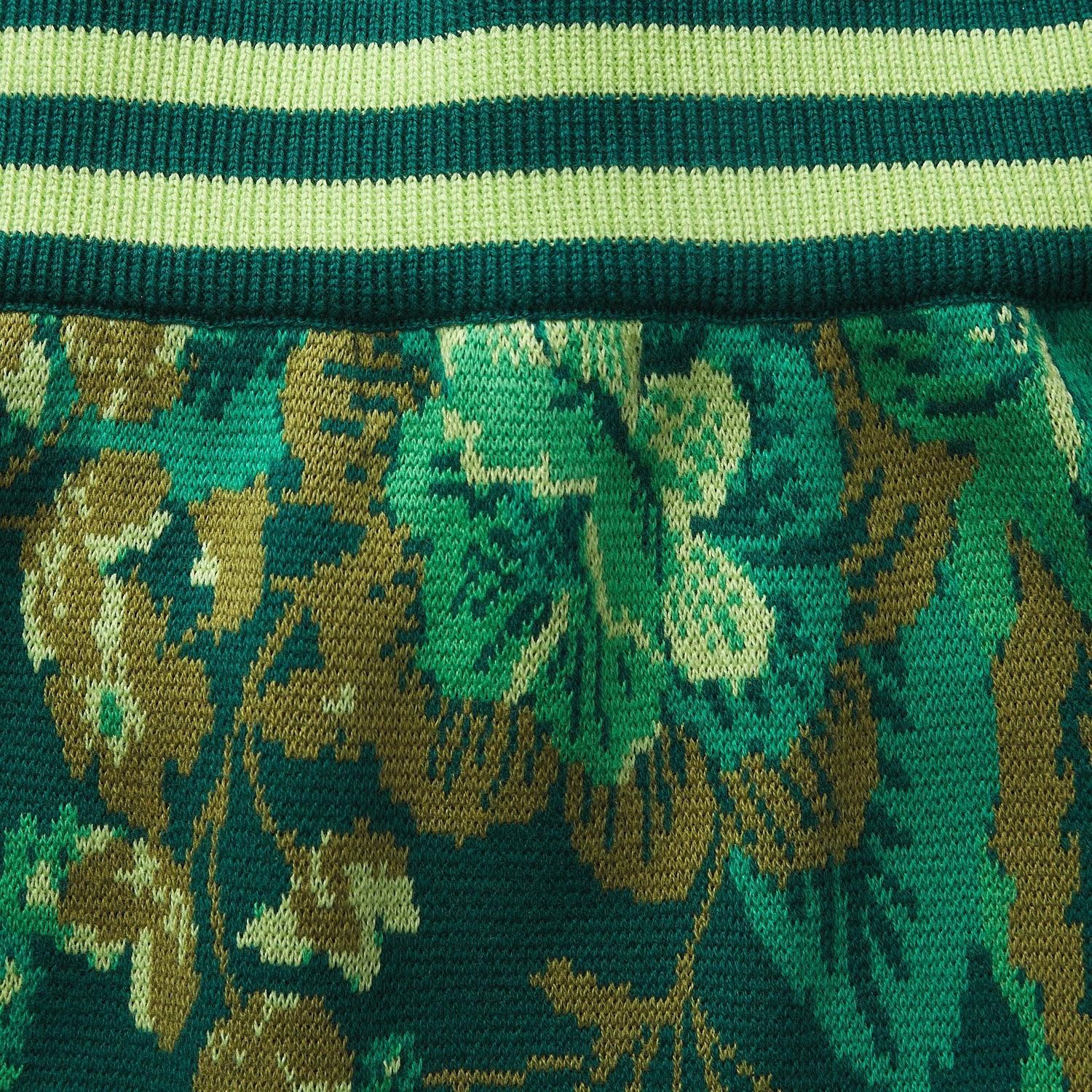 Close-up of Eliza Knit Maxi Skirt waistband detail showing striped elastic and floral knit pattern