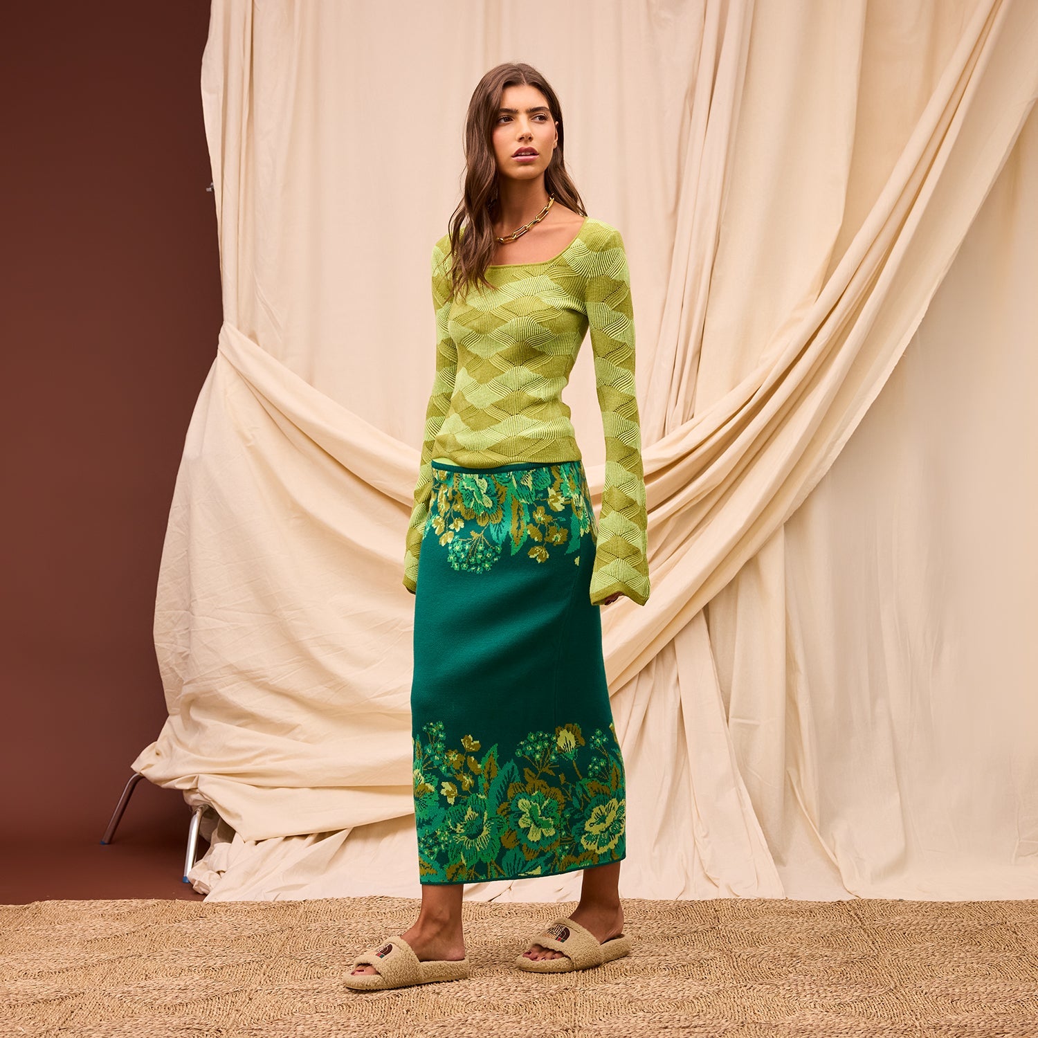 Model styled in white tee with Sage Clare Eliza Knit Maxi Skirt for casual chic look
