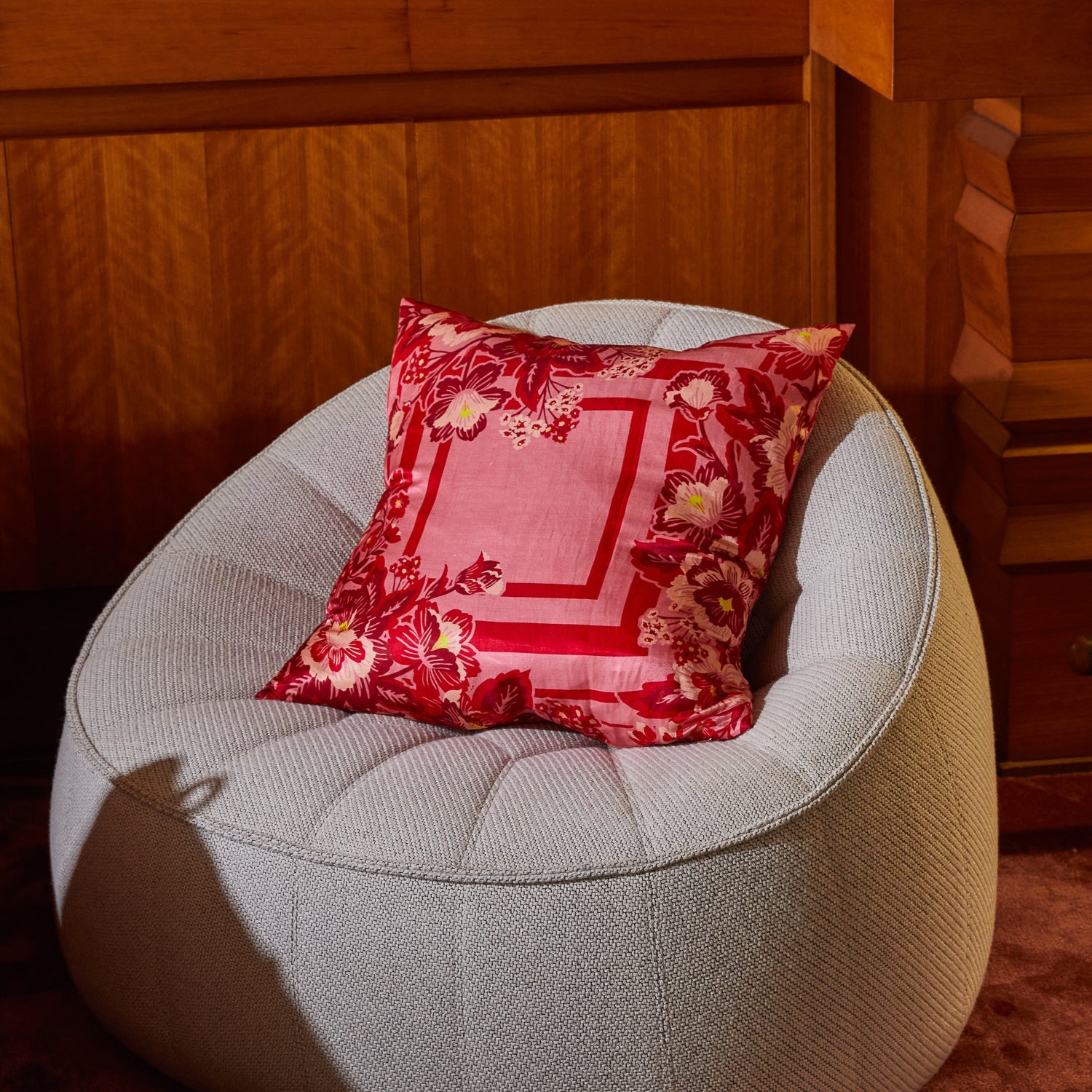 Eliza Silk-Linen Cushion in Primrose by Sage & Clare with pink floral border and geometric center design