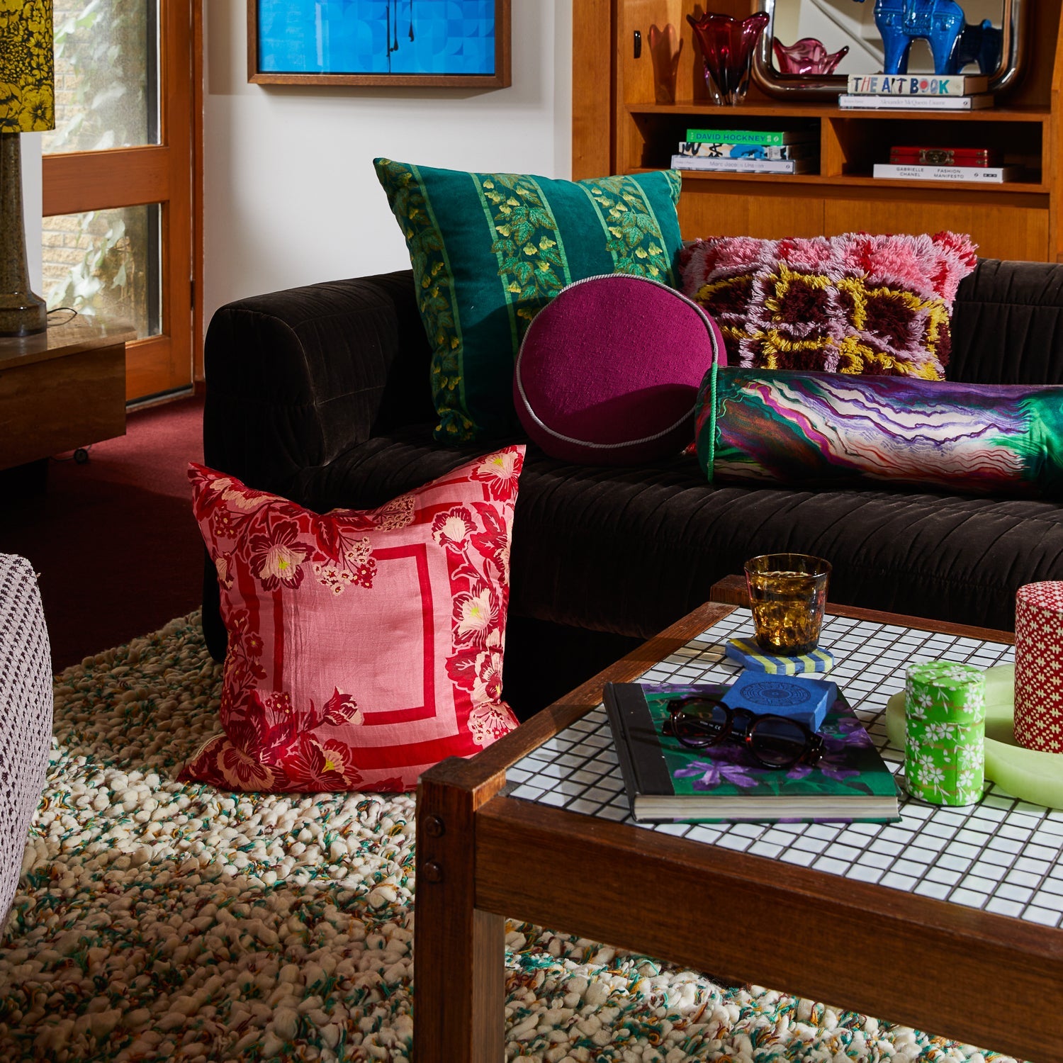 Living room styling with Eliza Silk-Linen Cushion layered among colorful decorative cushions on sofa