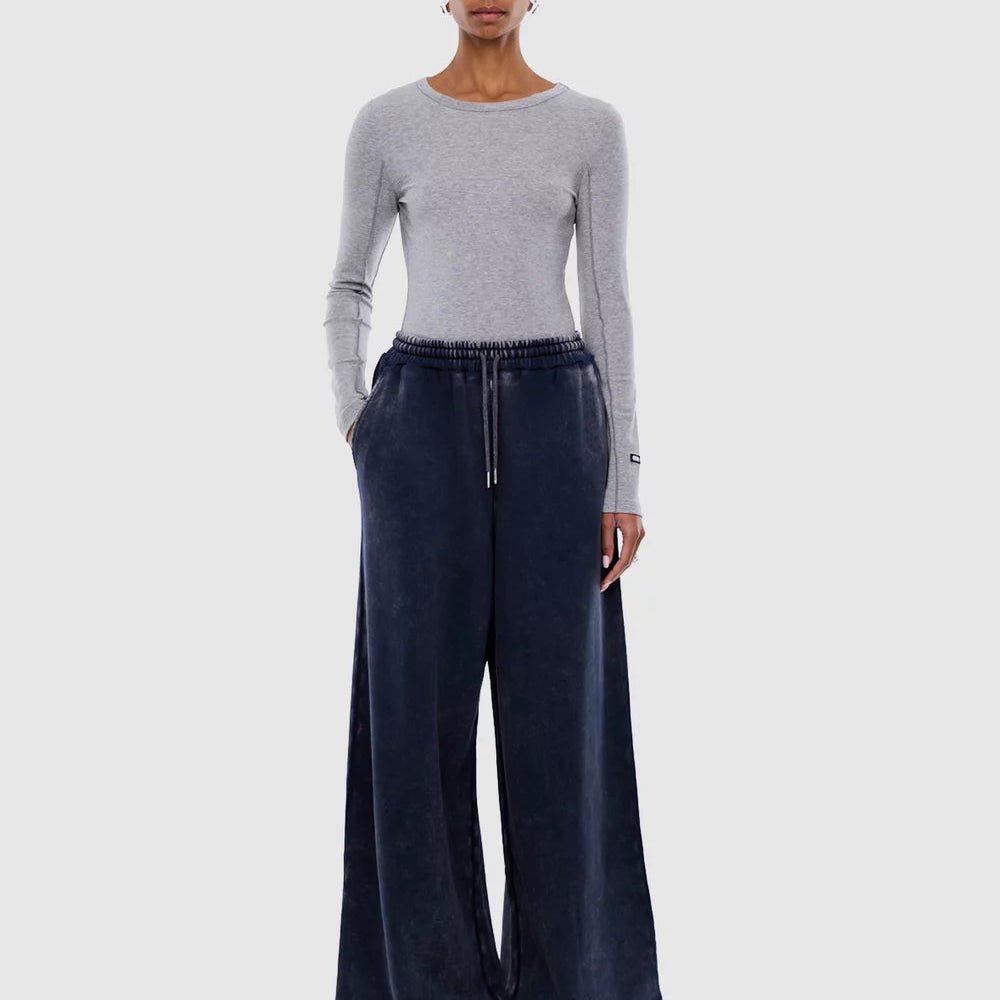 Front view of Asher Track Pant in washed ink with drawstring waist and wide leg styling