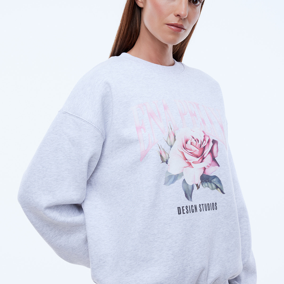 White marle oversized sweatshirt with feminine rose floral print and drop shoulder relaxed fit