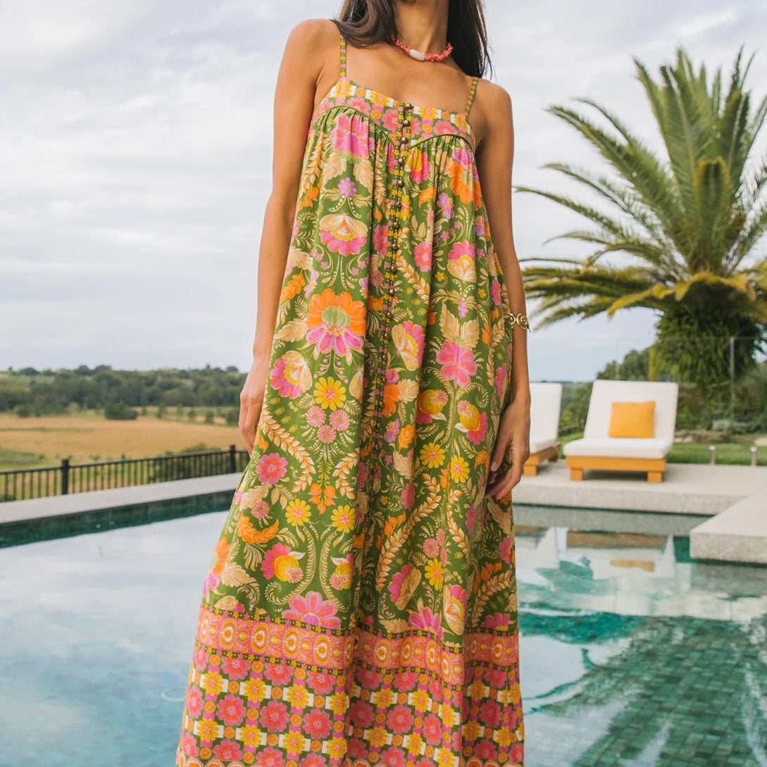 Side angle of Estella dress guava showing gathered bust detail and flattering shaped yoke construction