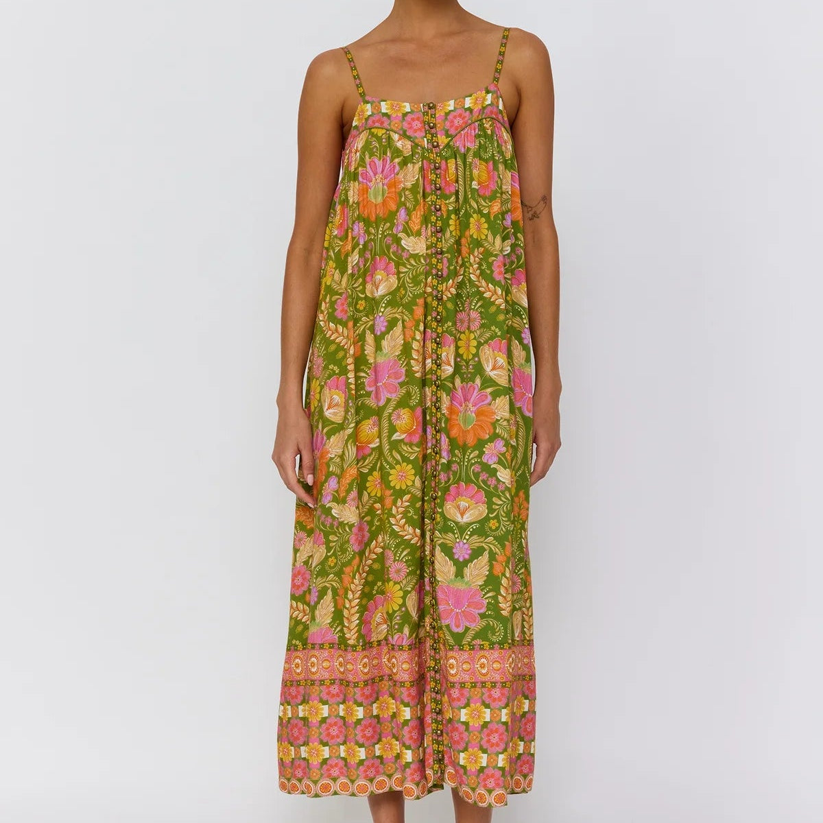 Estella dress guava ruffle hem detail close up showing graceful movement and flowy fabric drape