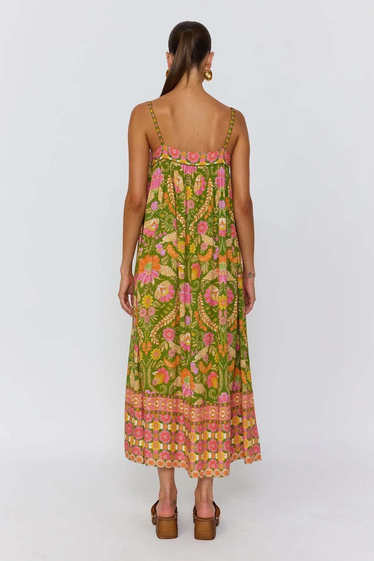 Model wearing Nine Lives Bazaar Estella dress guava in lifestyle setting perfect for summer outings