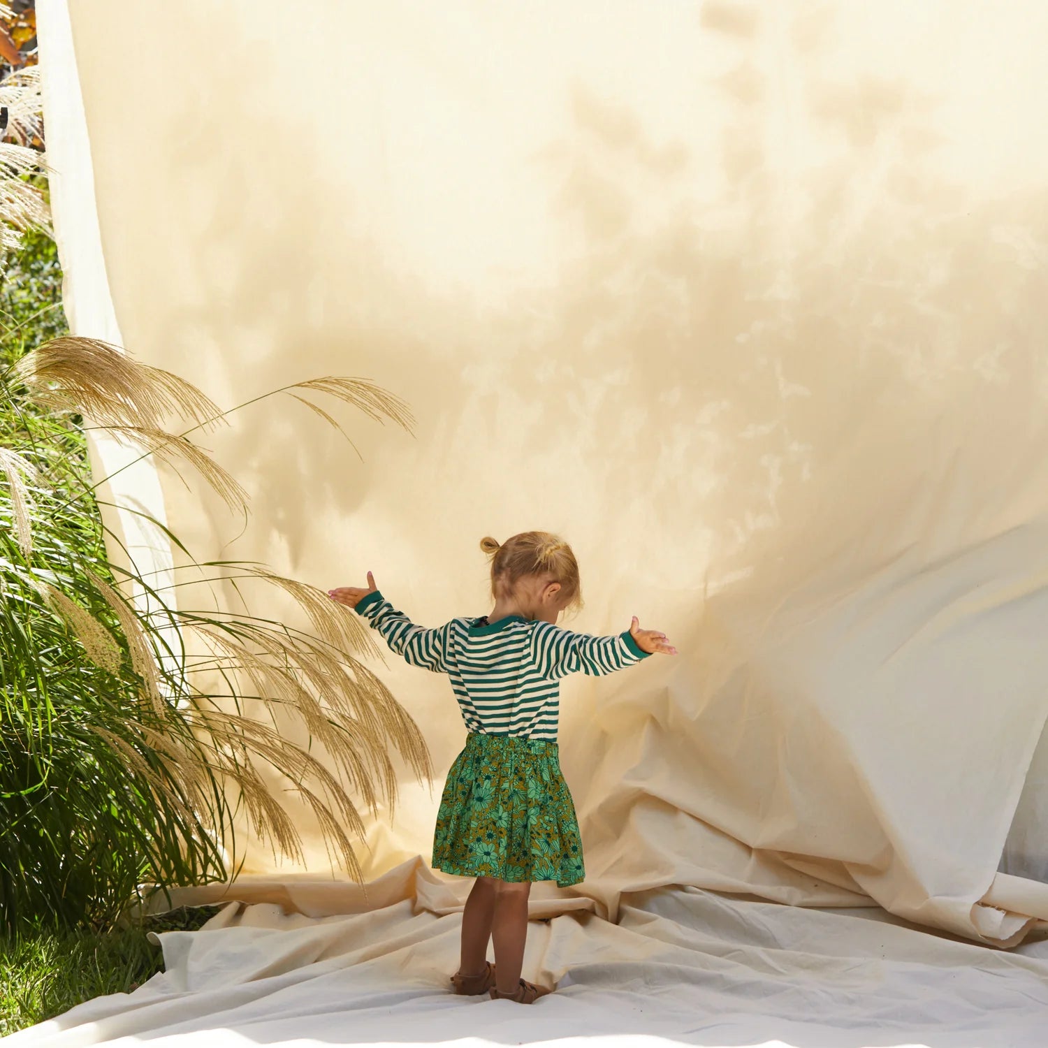 girl wearing Evette kids skirt - martini by Sage & Clare