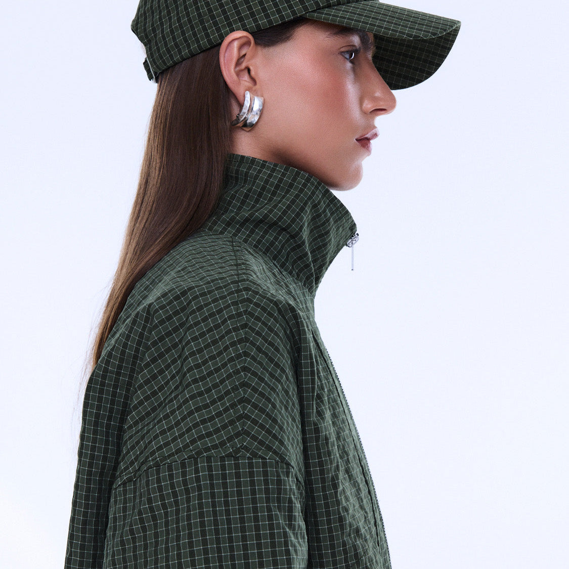 Side angle view of Fallon Check Cap displaying check pattern and structured baseball cap silhouette
