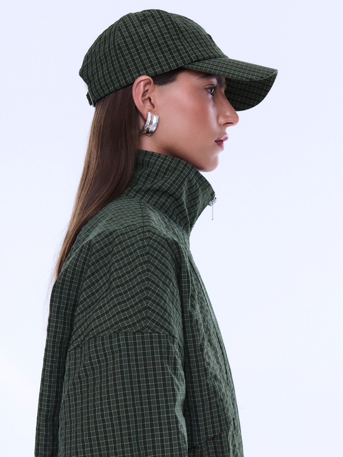 Side angle view of Fallon Check Cap displaying check pattern and structured baseball cap silhouette
