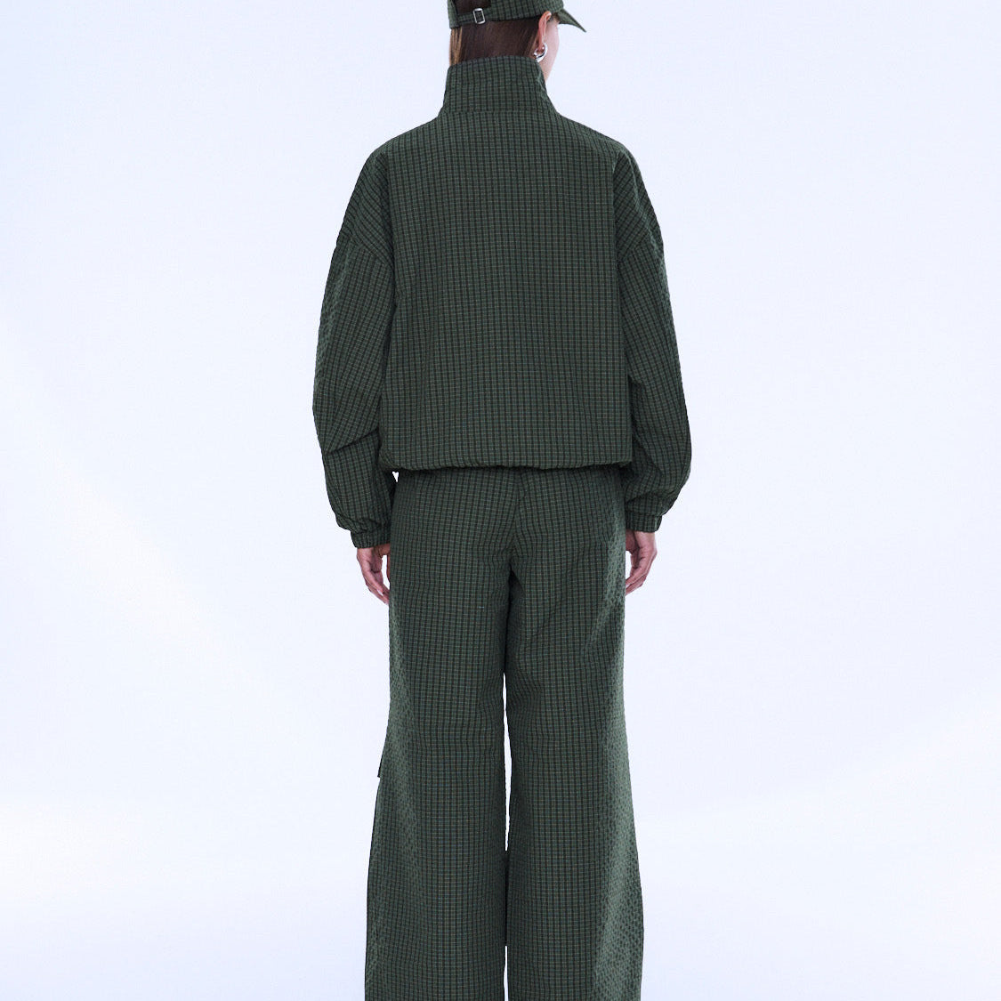 Back view of Fallon Zip Thru Jacket showing olive check pattern and cropped bomber style