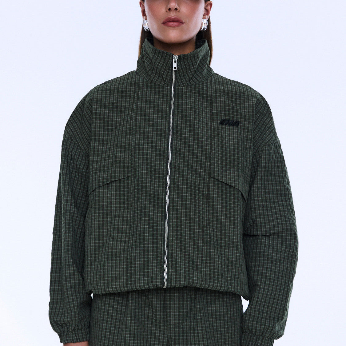 Front view of Fallon Zip Thru Jacket with chest pockets and olive check fabric detail