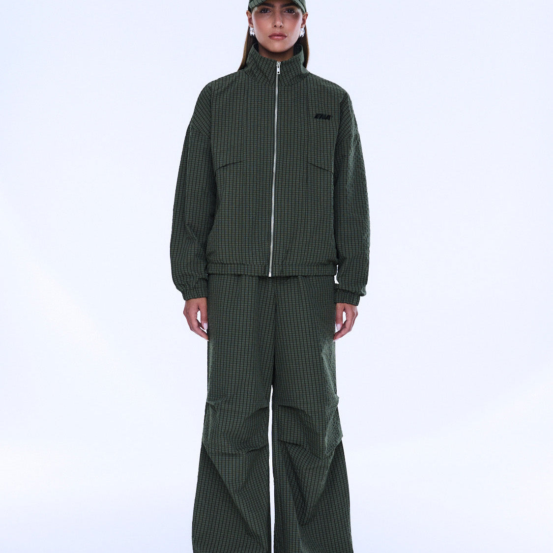 Front view of Fallon Zip Thru Jacket in olive check with ribbed cuffs and hem detail