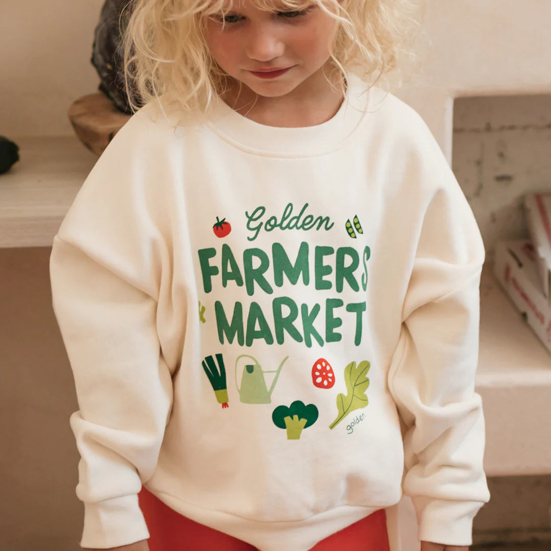 child wearing cream farmers market jumper by Golden Children.