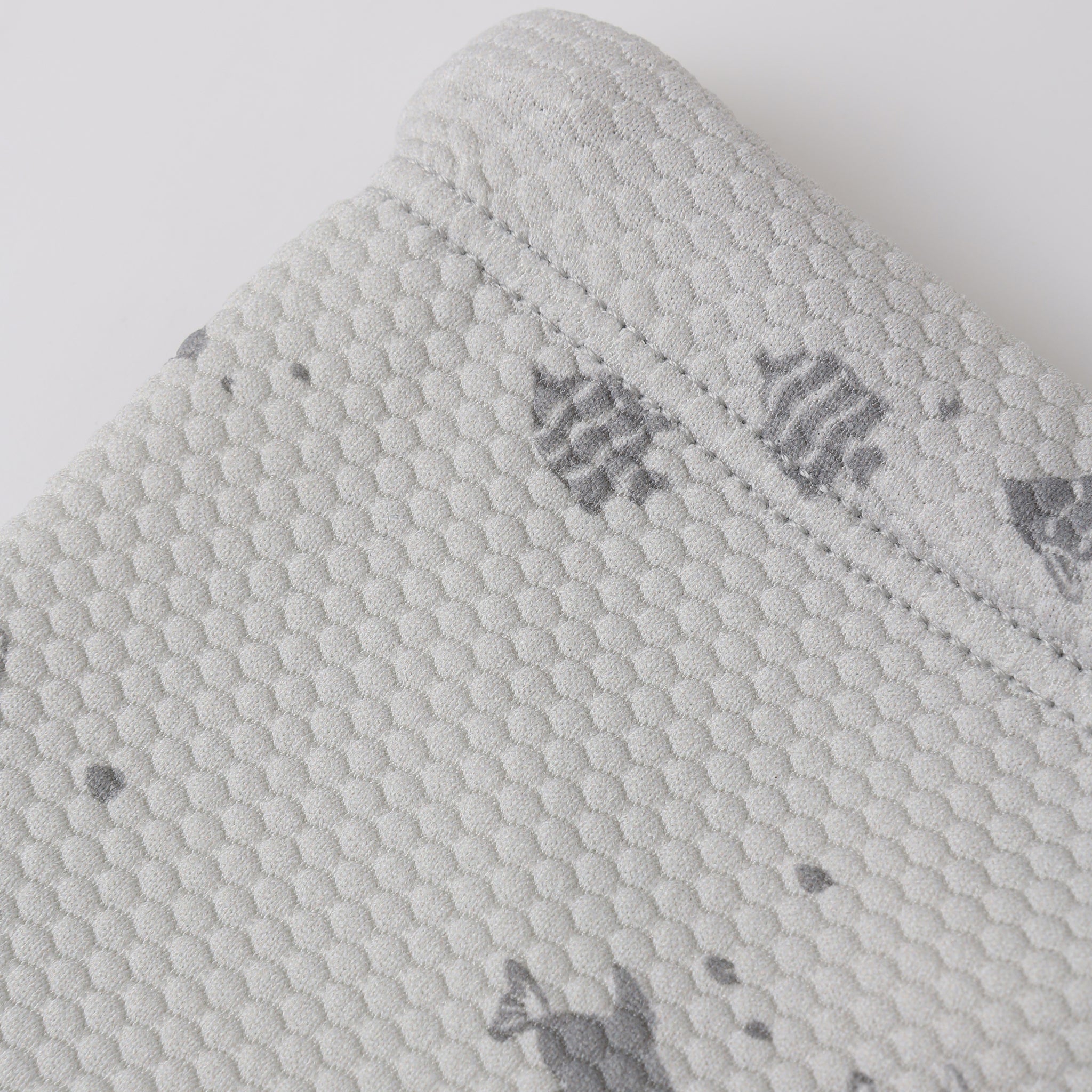Close up of shorts fabric and print on the Finn Rashguard + Short Set Fish | Quincy Mae