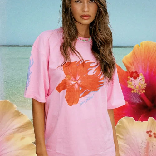 model wearing the 100% cotton pink Flaming Hibiscus T-Shirt by Sea Street