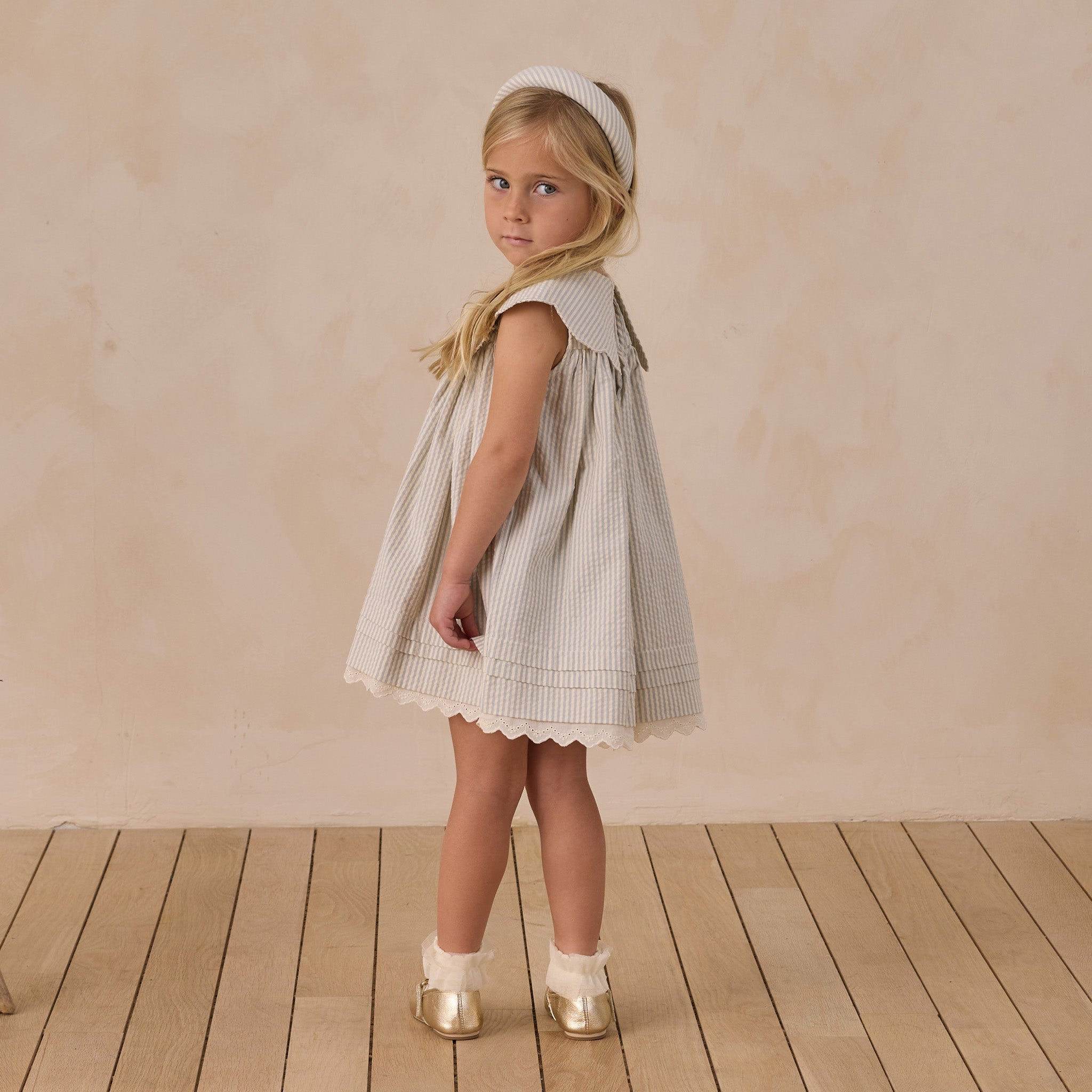 Side view of Florence Dress showing scalloped collar detail and A-line silhouette