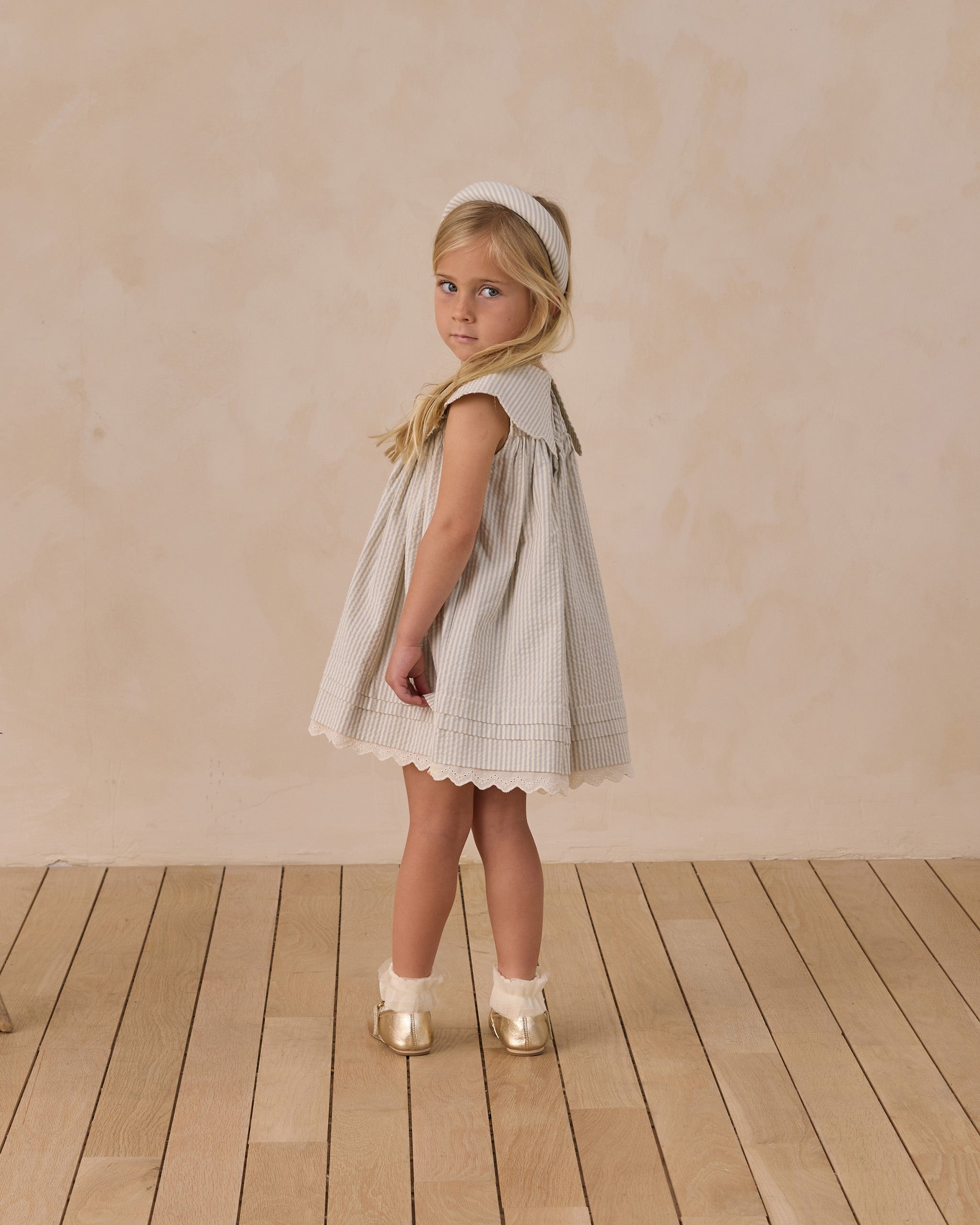 Side view of Florence Dress showing scalloped collar detail and A-line silhouette