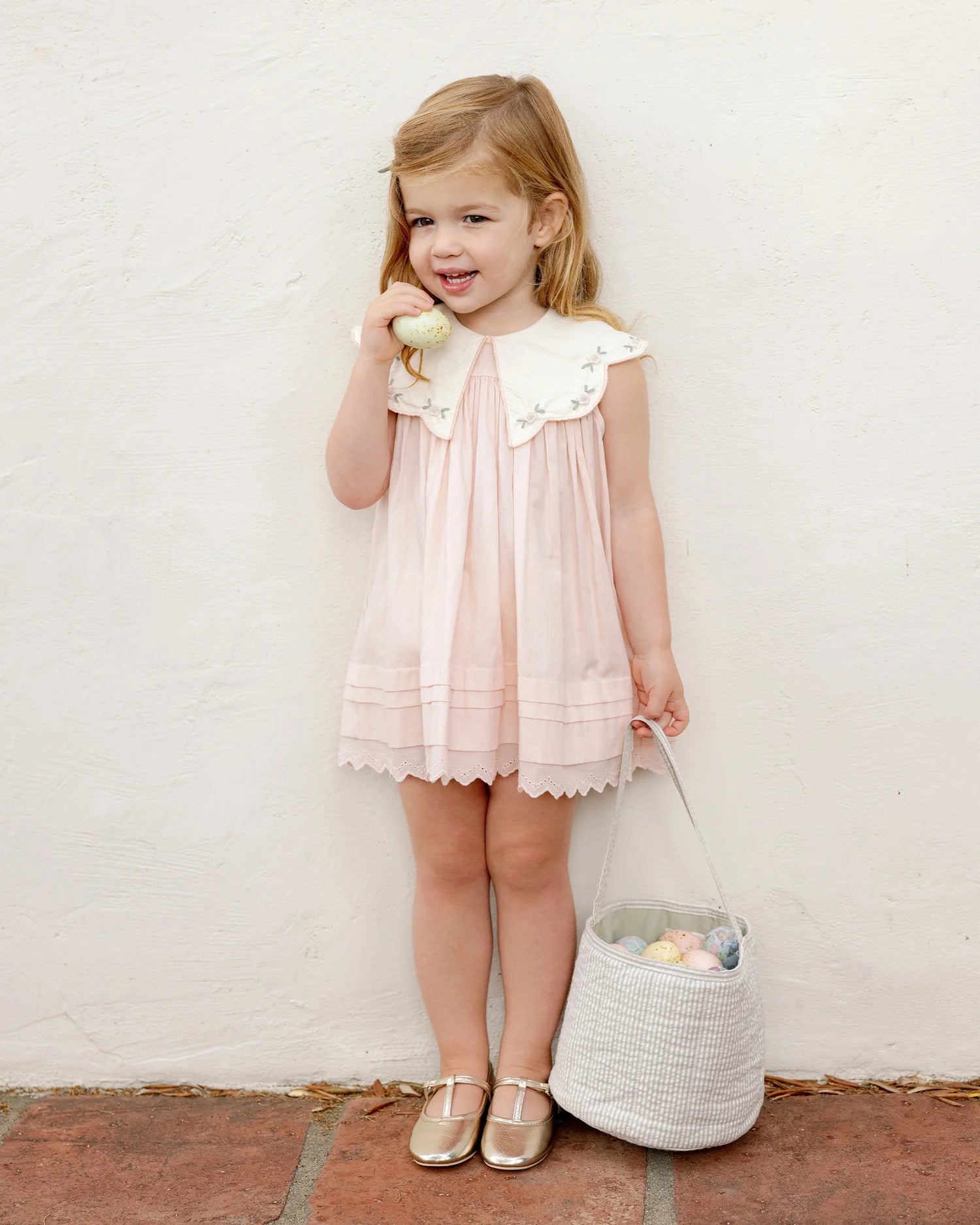 Girl wearing Florence Dress in pink by Noralee