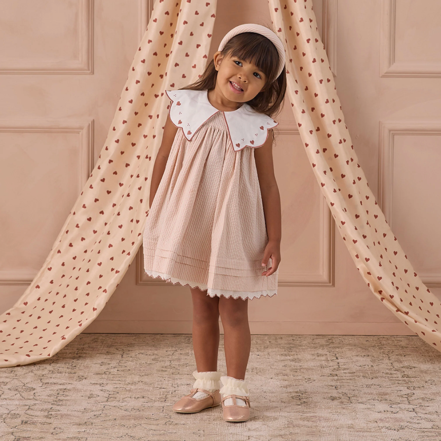 Girl wearing the Florence Dress - Petal | Noralee