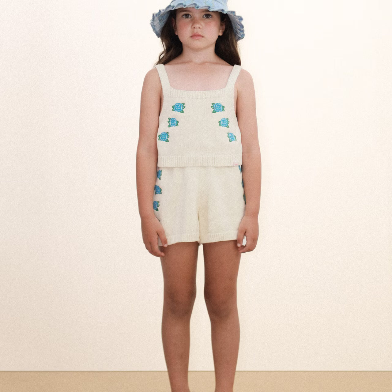 girl wearing Flowers Knitted Crop Top - Light Cream by Tiny Cottons - cream crop singlet with blue flowers