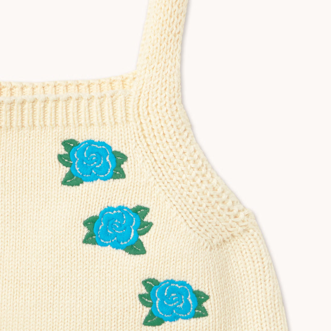 close up embroidery detail of blue flowers on Flowers Knitted Crop Top - Light Cream by Tiny Cottons