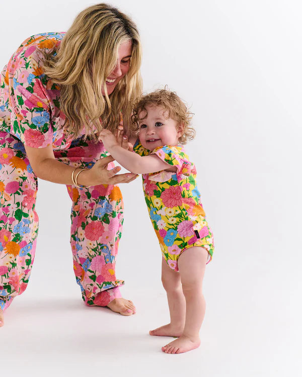 Kip and Co yellow floral baby onesie with flowers and bees