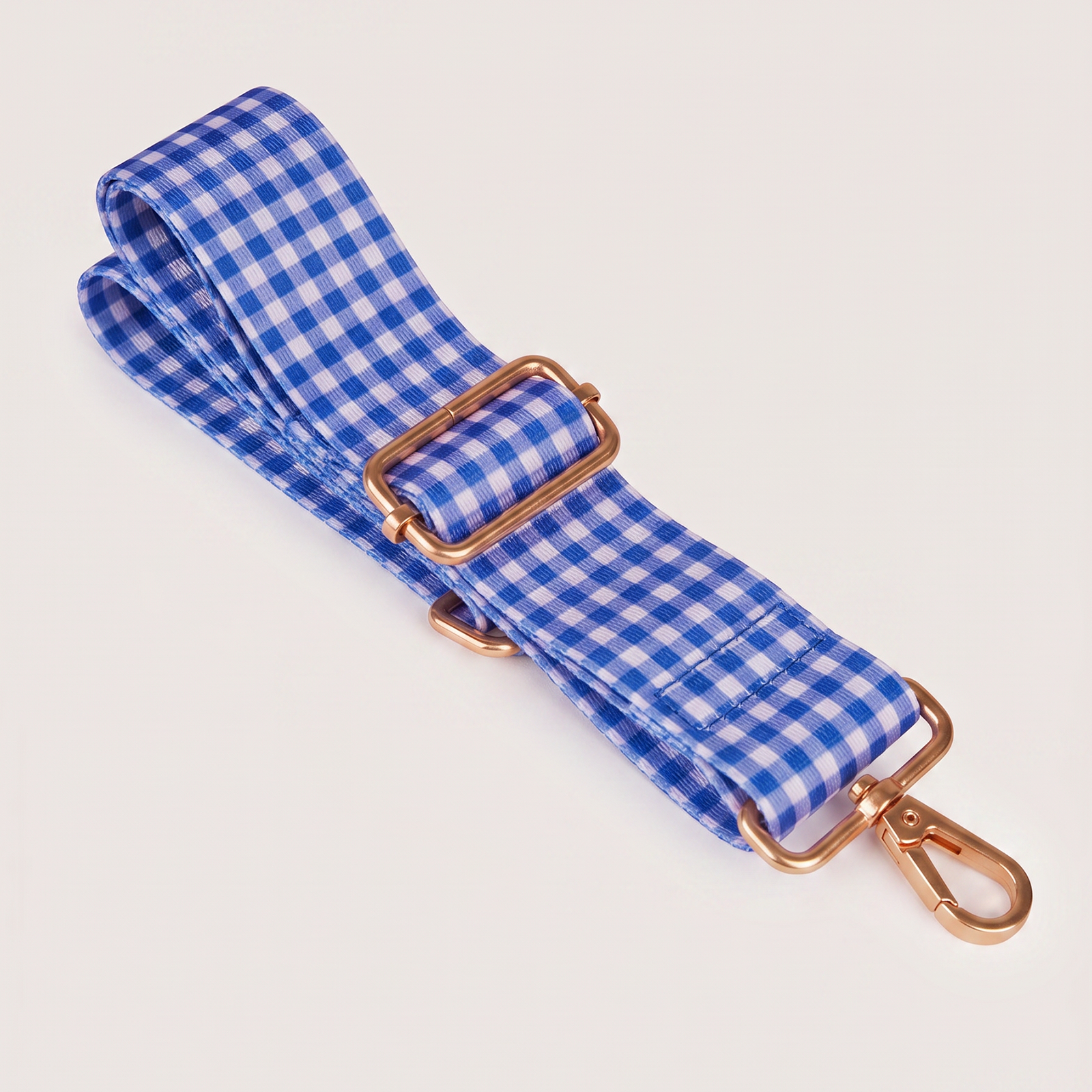 Foxwood lunch tote in blue gingham and floral pattern with matching bag displayed on blue background