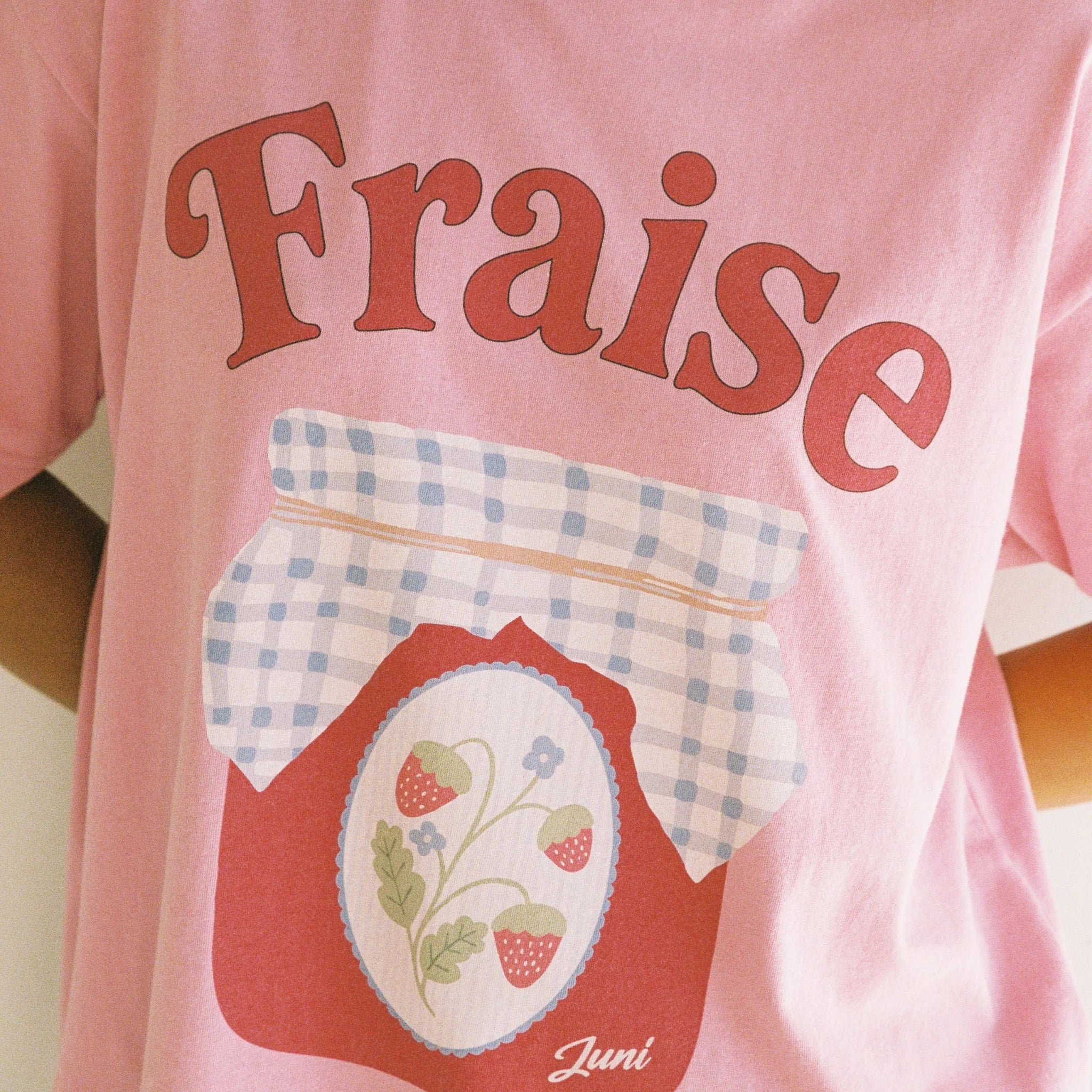 Pink tshirt with strawberry jam jar graphic and the words "Fraise" by Juni