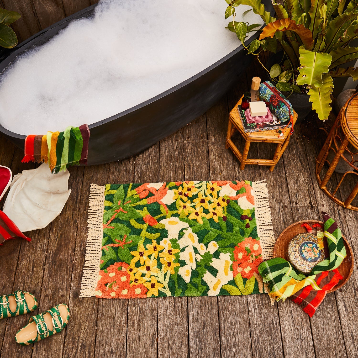 Floral green, orange and yellow bath mat by Sage & Clare