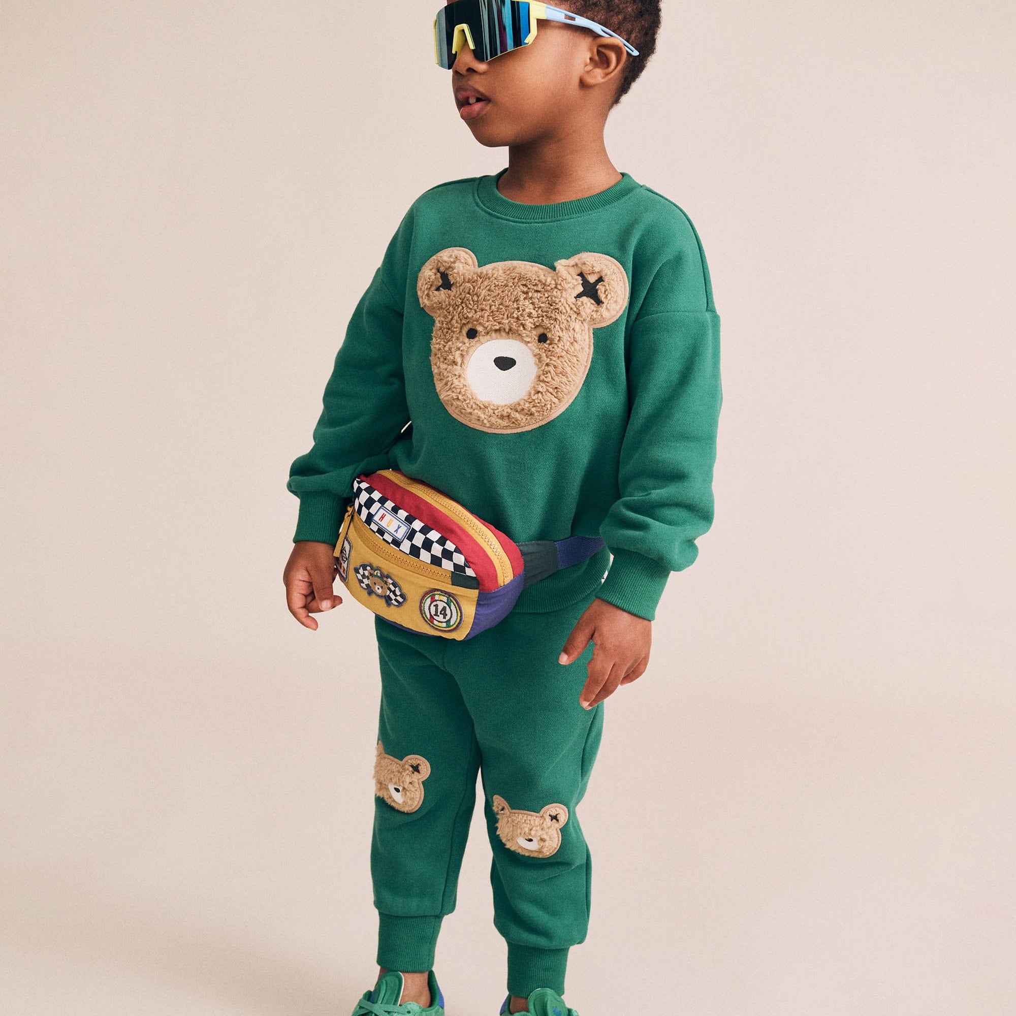 Front view of boy wearing the Furry Huxbear Emerald Sweatshirt | Huxbaby