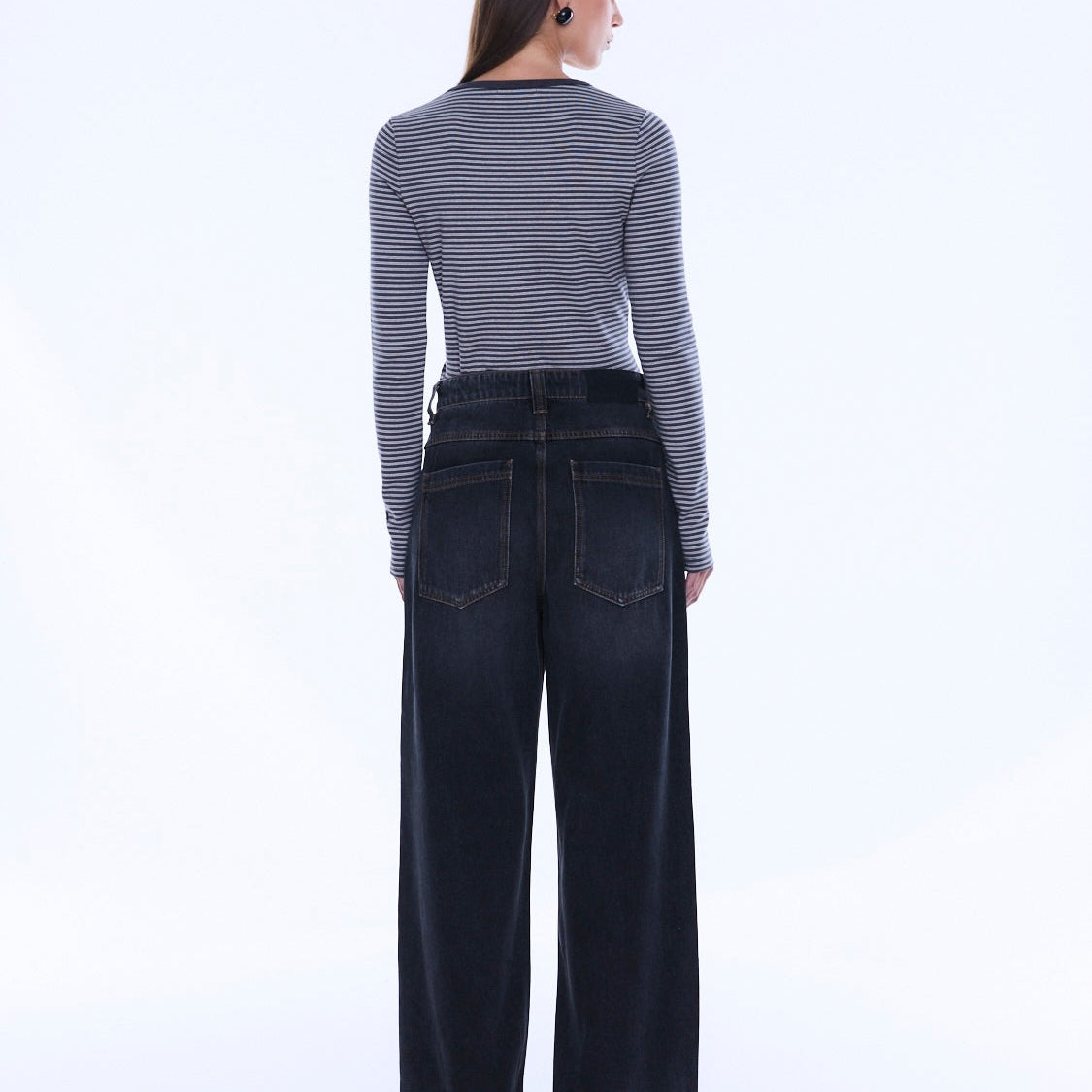 Back view of Georgia Denim Jean showcasing rear pockets and wide leg shape in dark wash denim