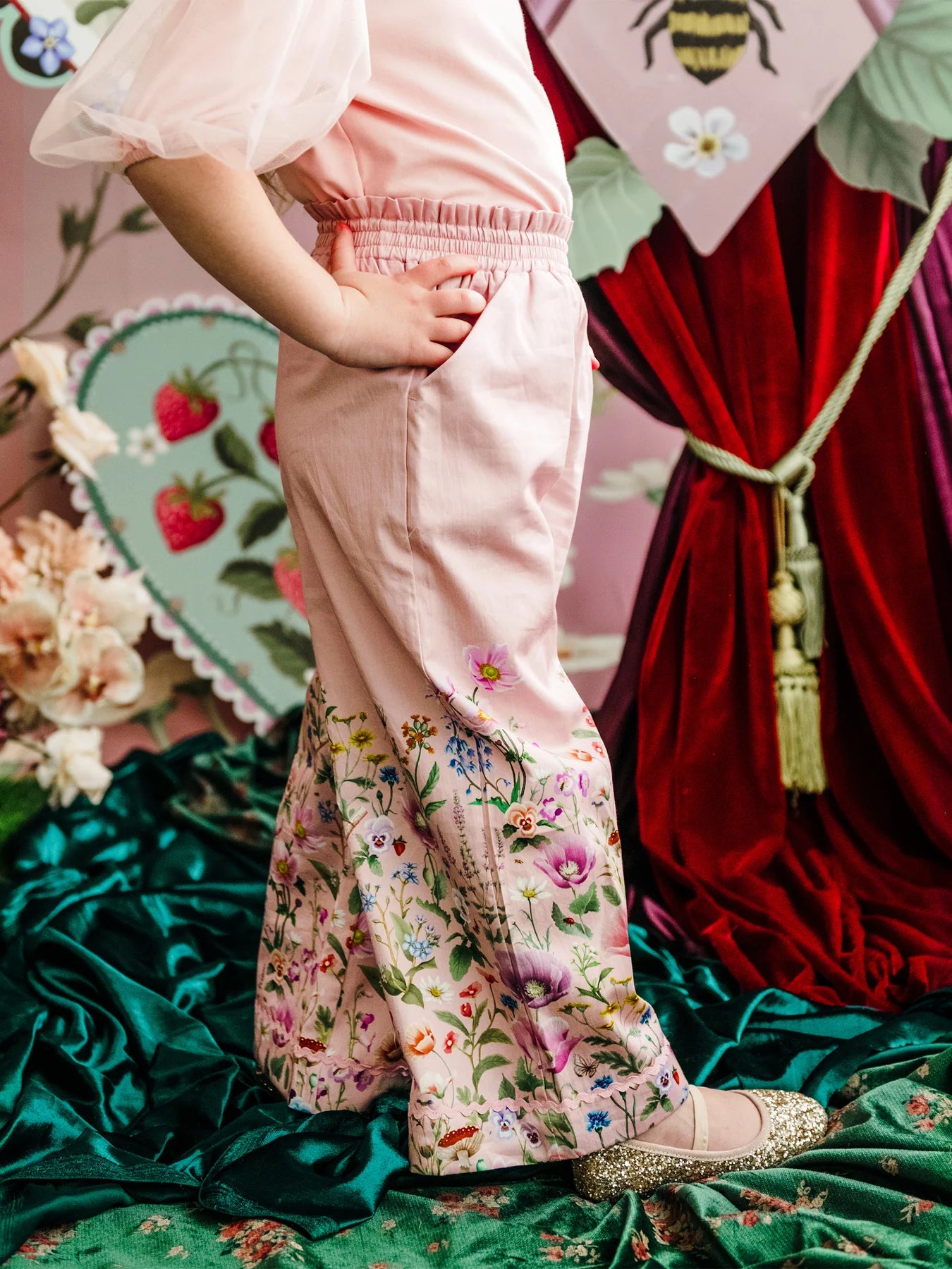 Child wearing a pink outfit with floral pants by Fleur Harris - "Garden of Dreams" Meadow Pant - Pink by Fleur Harris