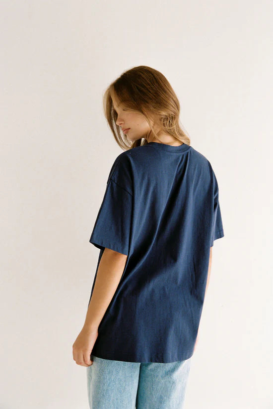 back detail of model wearing Navy Garnet Tee by Juni