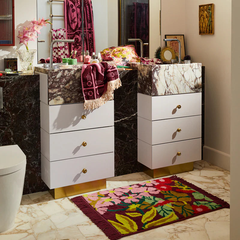 beautiful rich burgundy bath mat with floral pattern made from organic cotton