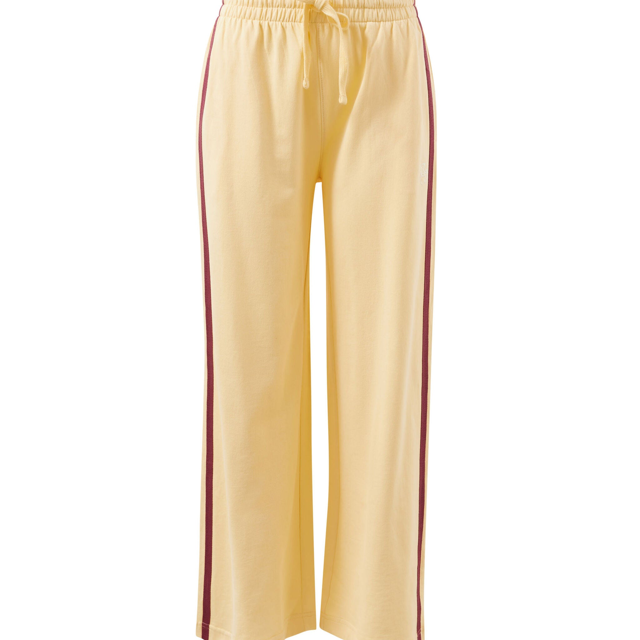 Front view of butter yellow wide leg track pants with burgundy side stripe and elastic waistband