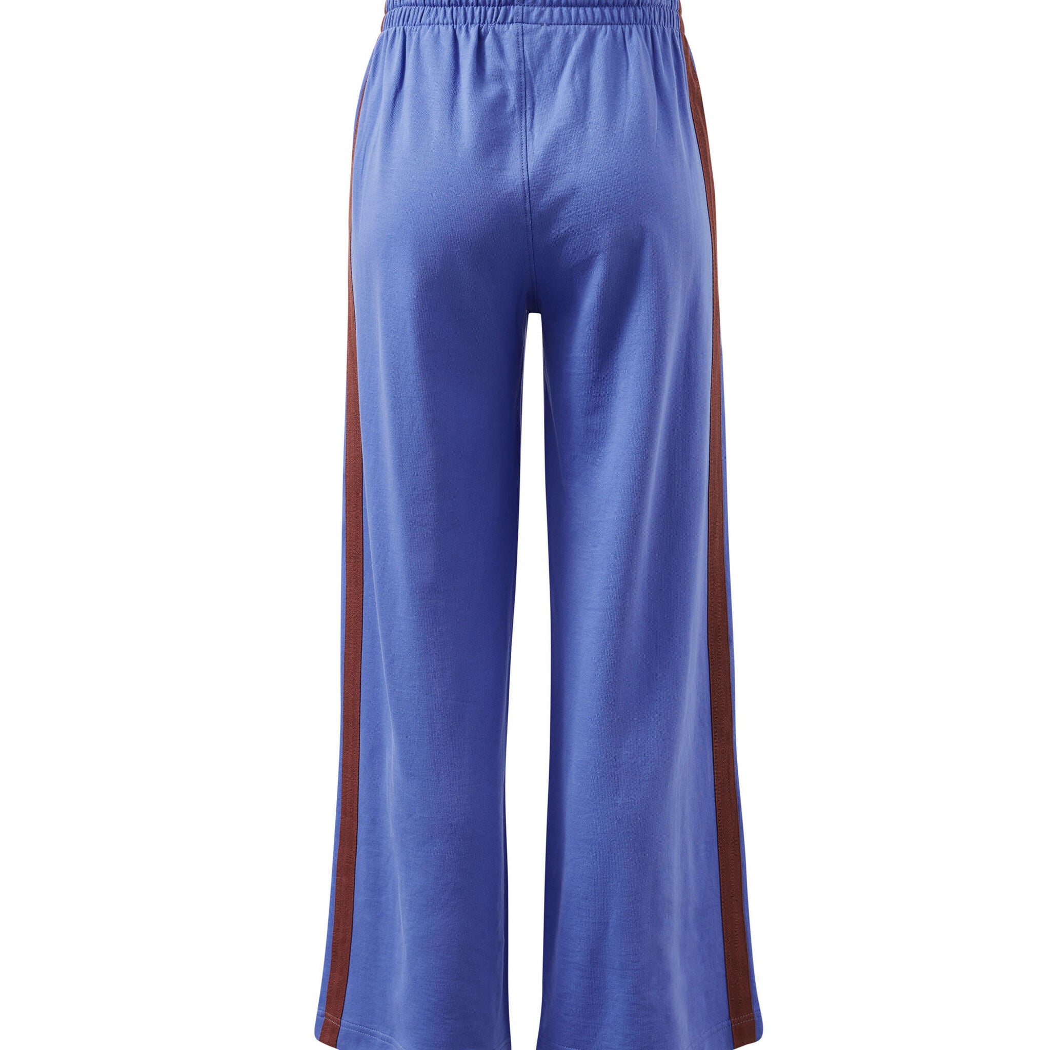 Back view of vintage blue terry trackpants displaying wide leg cut and burgundy side stripe