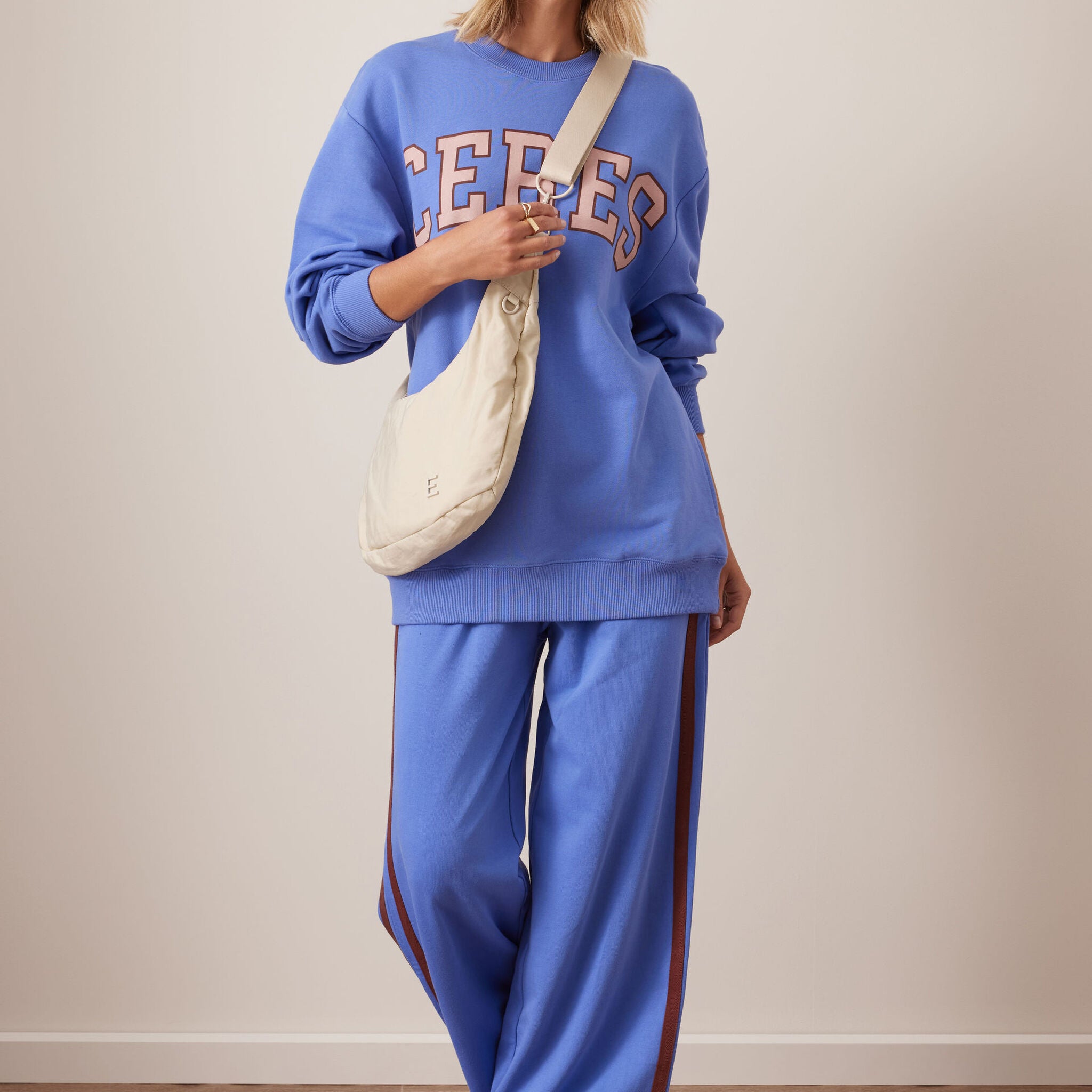 Full outfit styling with vintage blue terry trackpants paired with matching sweatshirt
