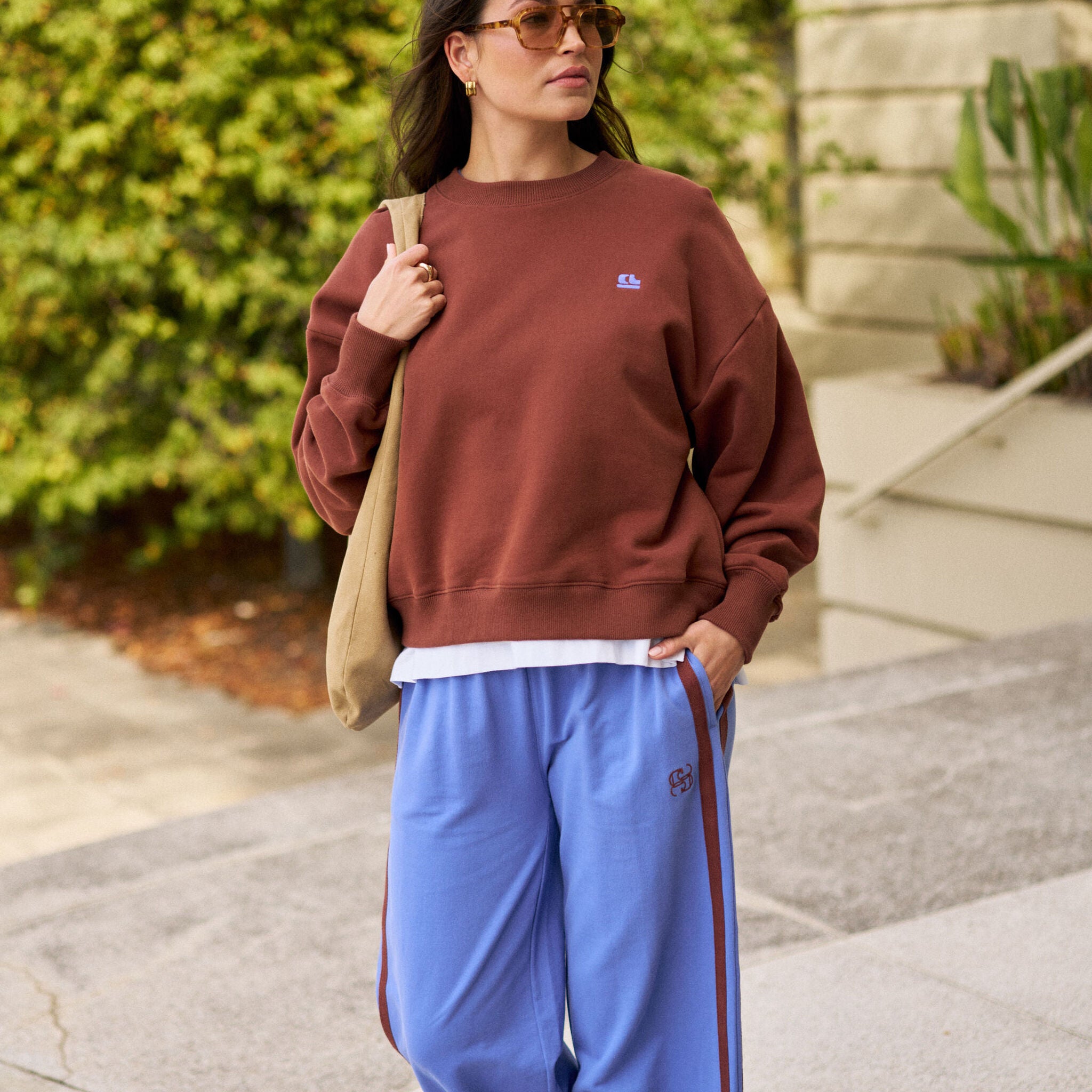 Street style look featuring vintage blue wide leg terry trackpants with coordinating top
