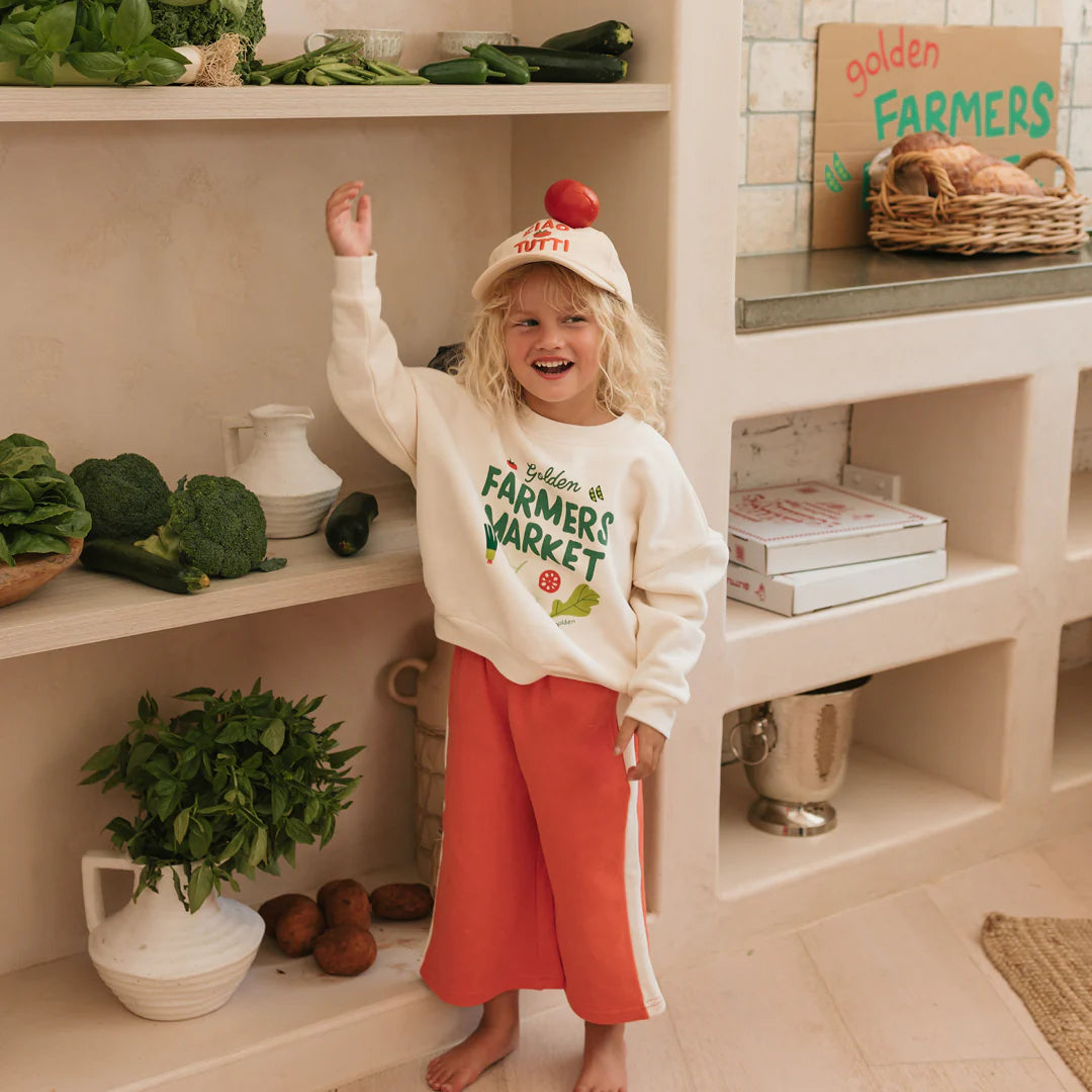 Fleece kids jumper with farmers market written on front. Cream colour with green writting and vegetable graphics