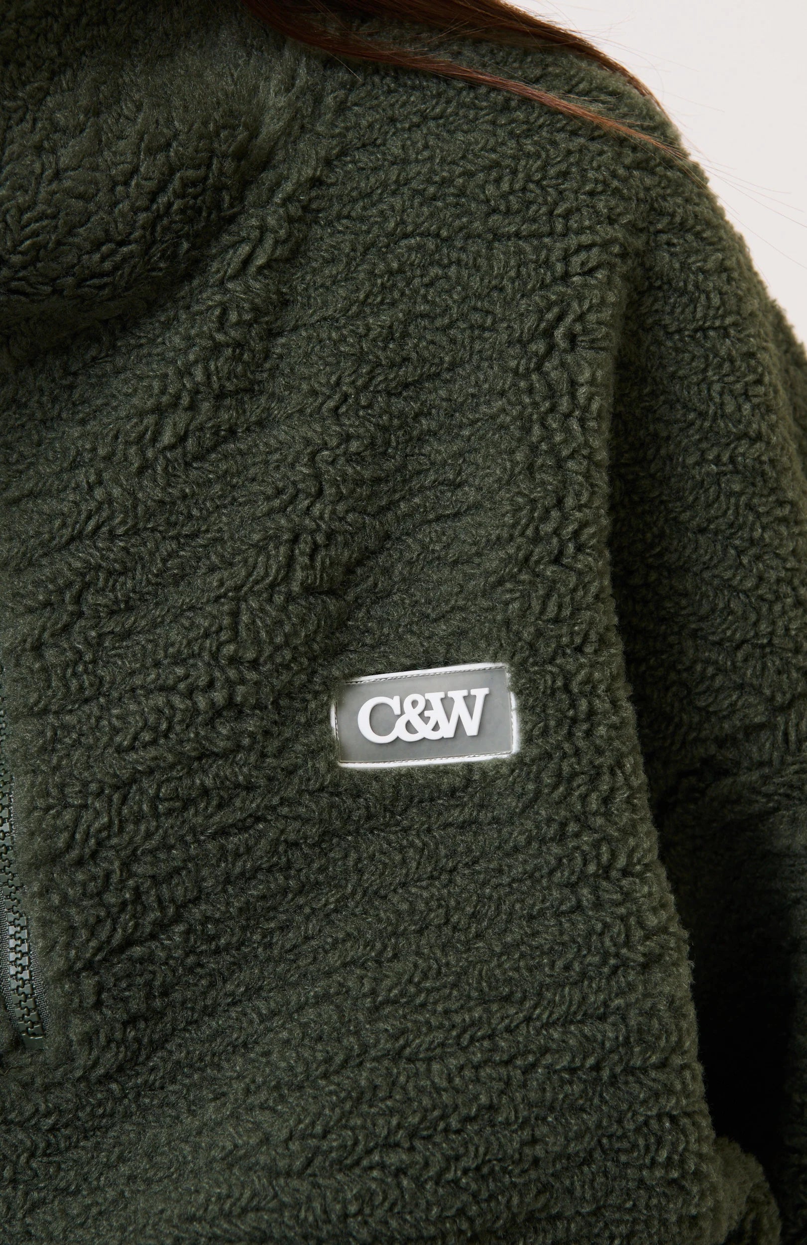 close up fabric and logo details of Celeste Pullover Thyme by Cartel & Willow