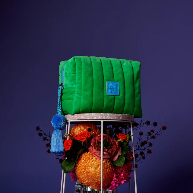 green cosmetic case with blue tassel