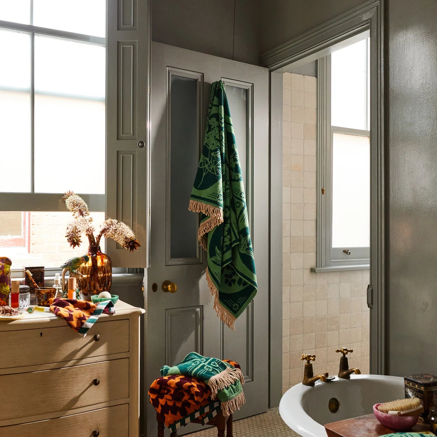 Green organic cotton terry toweling towel with fringed edge and retro floral design