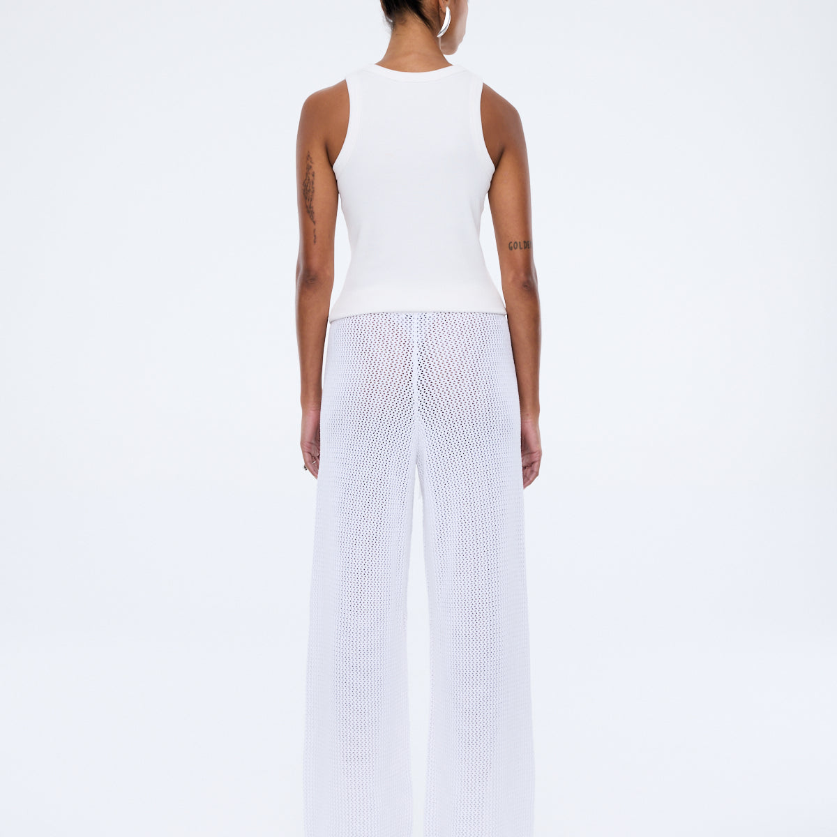 Close up detail of Harper Crochet Pant vintage white cotton crochet texture and rib waistband